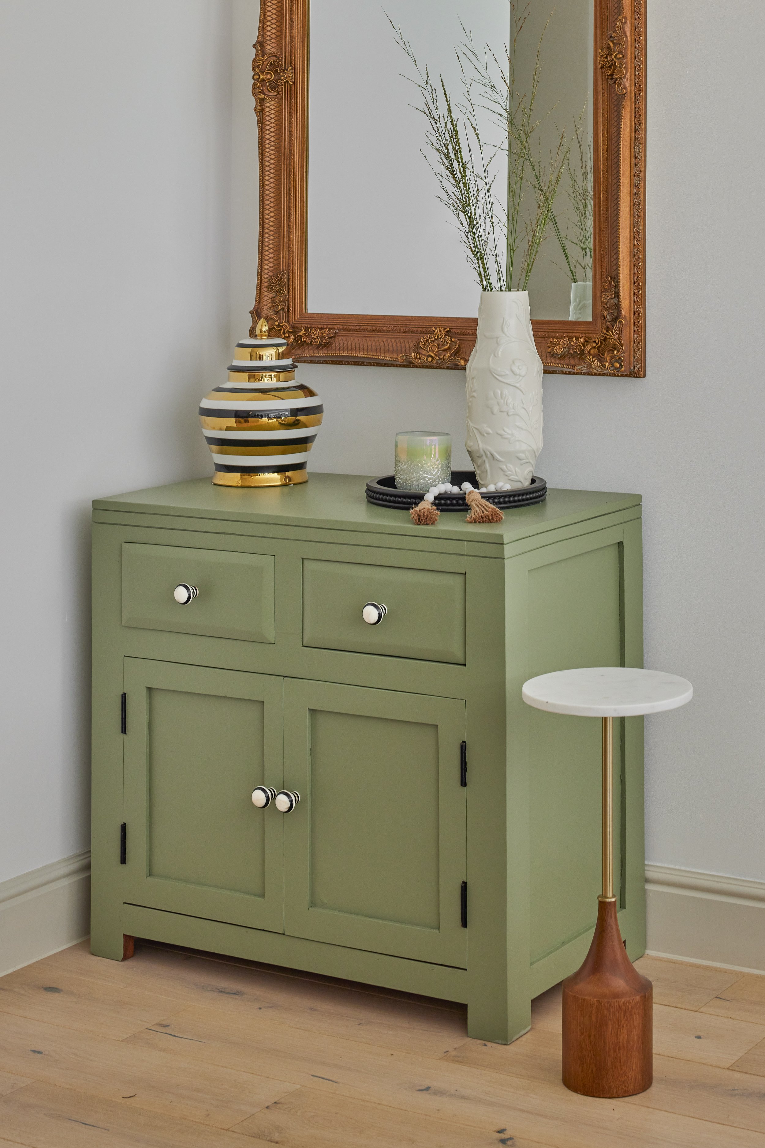 green-chest-of-drawers-after-black-white-knobs.jpg