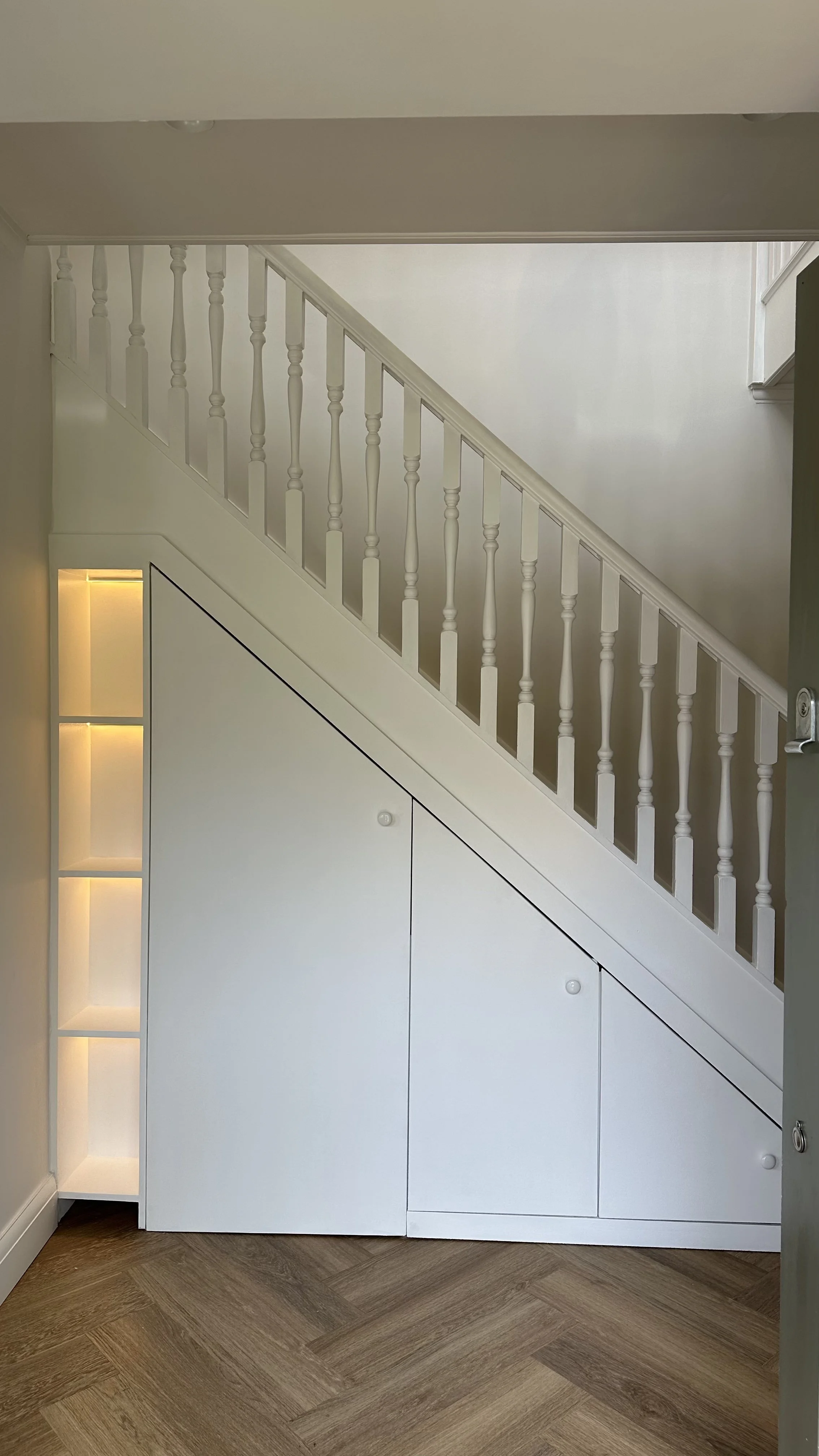 Bespoke under-stairs storage with concealed lighting, Wimbledon renovation