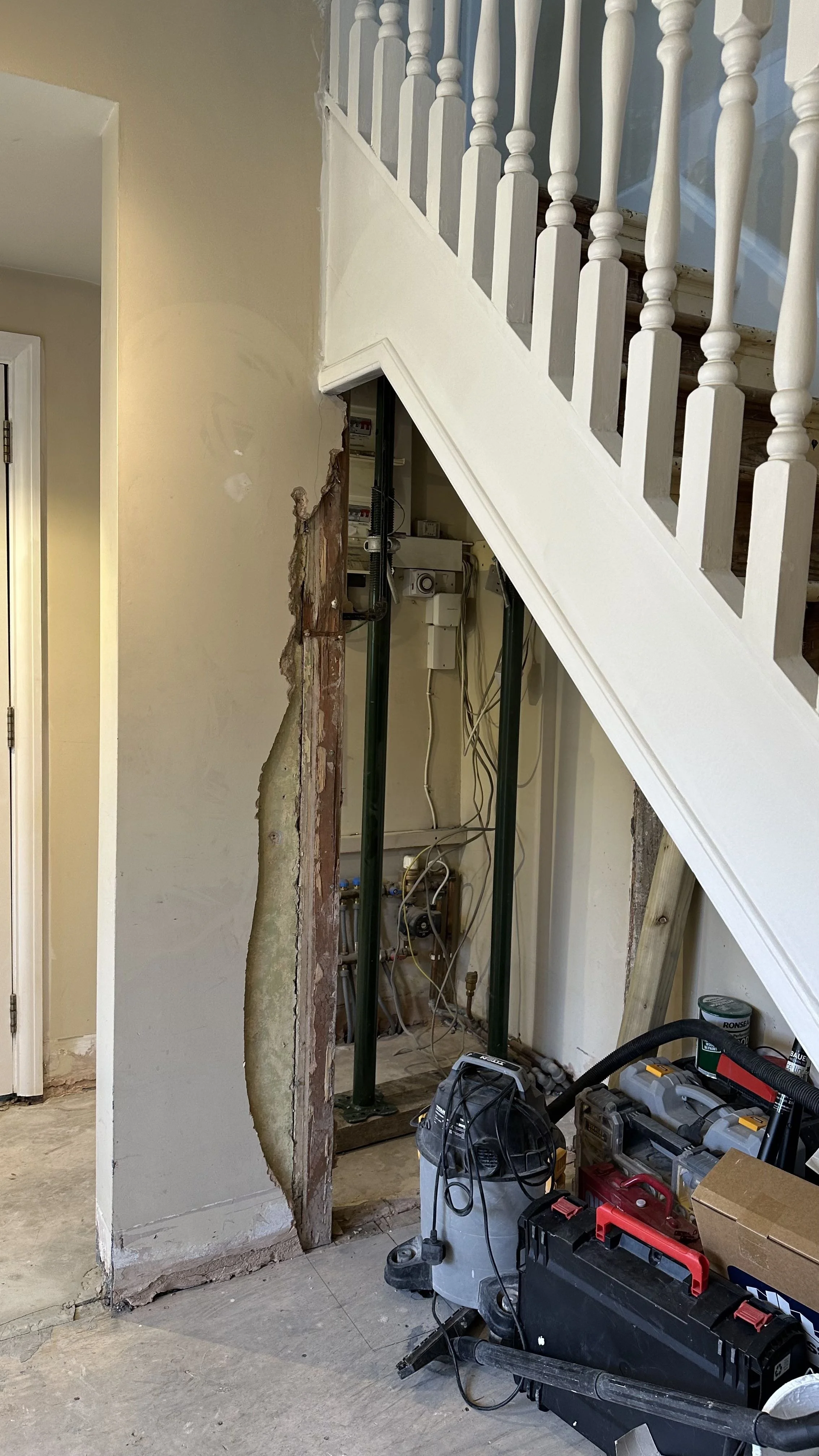Dividing wall removed during under-stairs renovation, Wimbledon