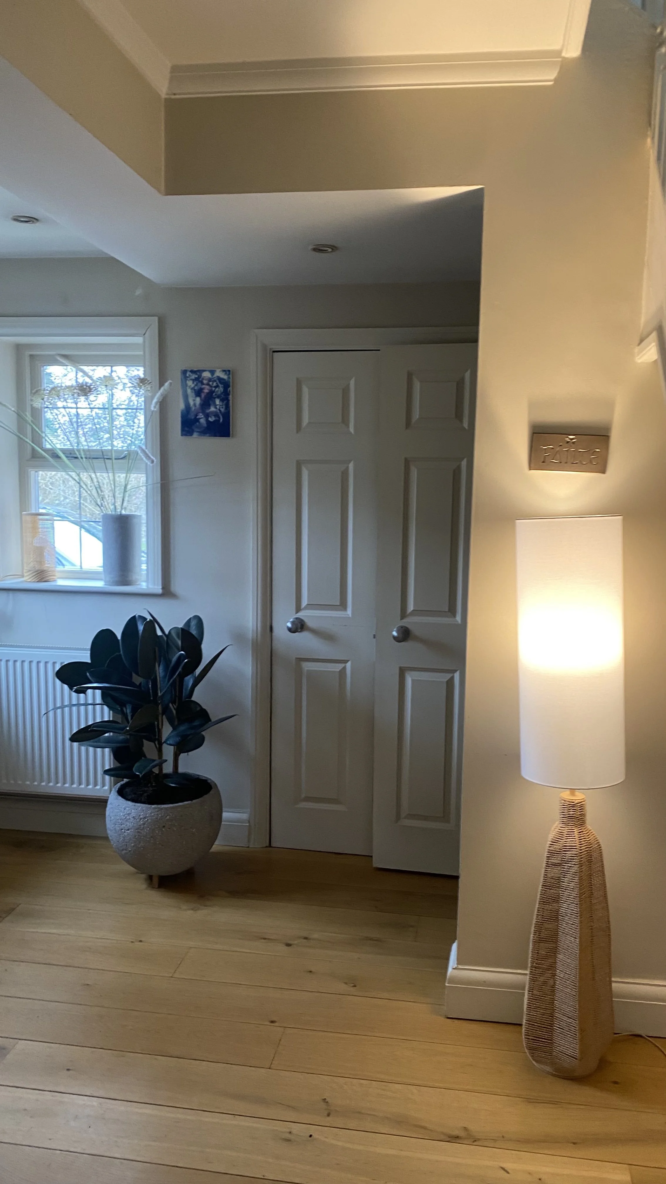 Entrance hallway with old radiator before renovation, Wimbledon