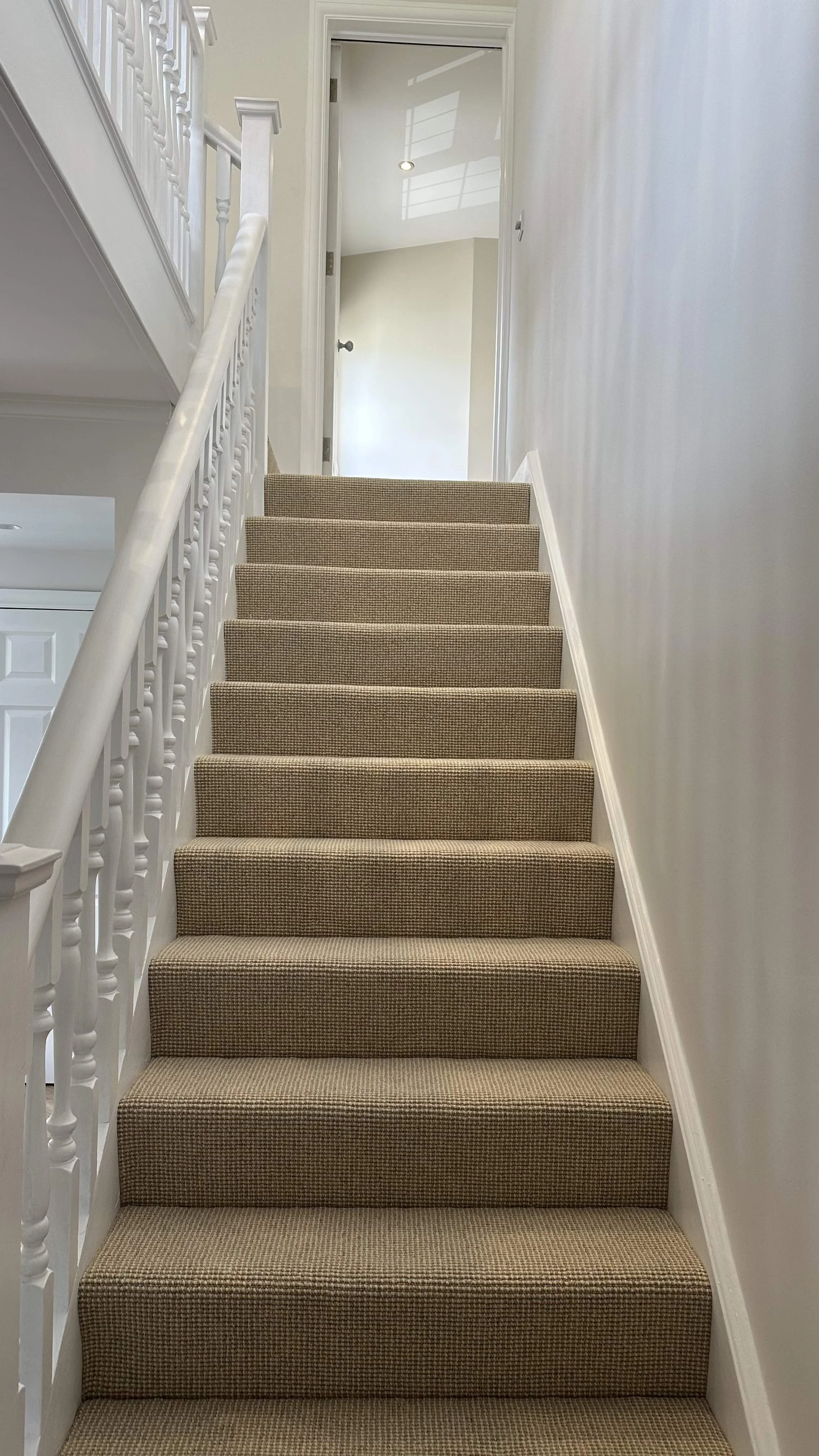Renovated staircase with patterned runner carpet, Wimbledon interior designer project