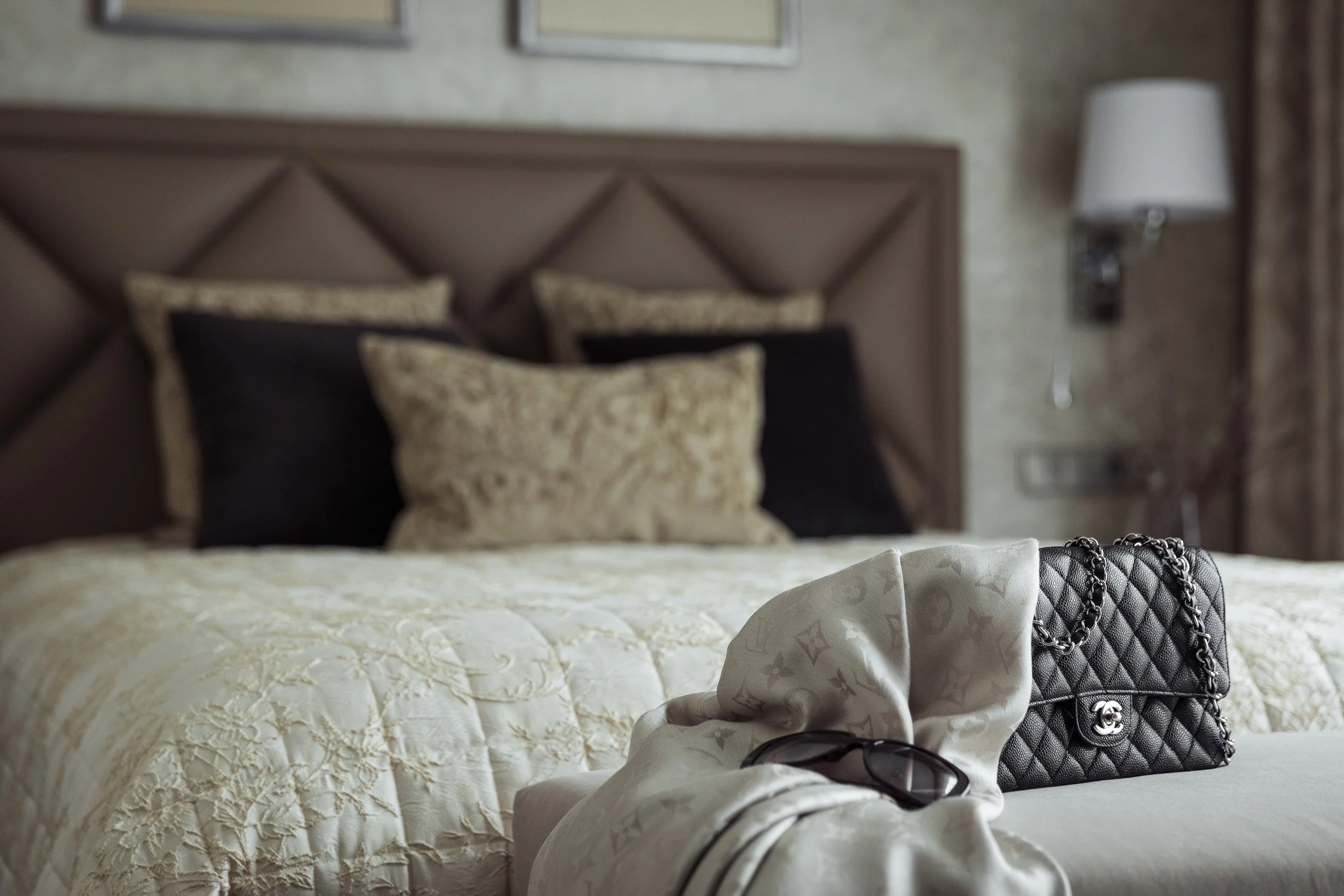 Richmond bedroom designed by Mond Design Interiors, featuring Art Deco-inspired style with beige and black bedding.