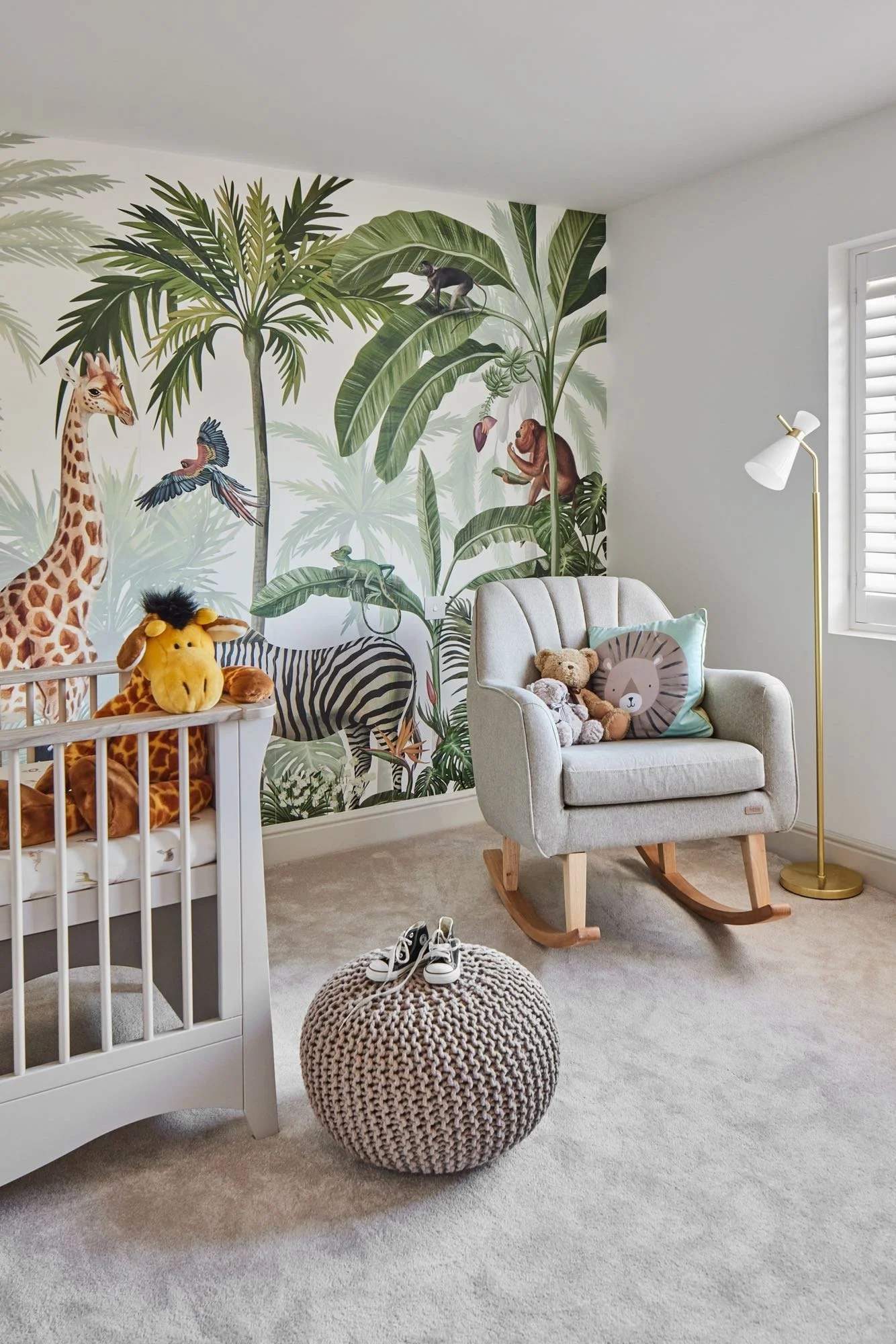 Wimbledon nursery interior with bright colors, jungle-themed décor, playful furniture, and smart storage.