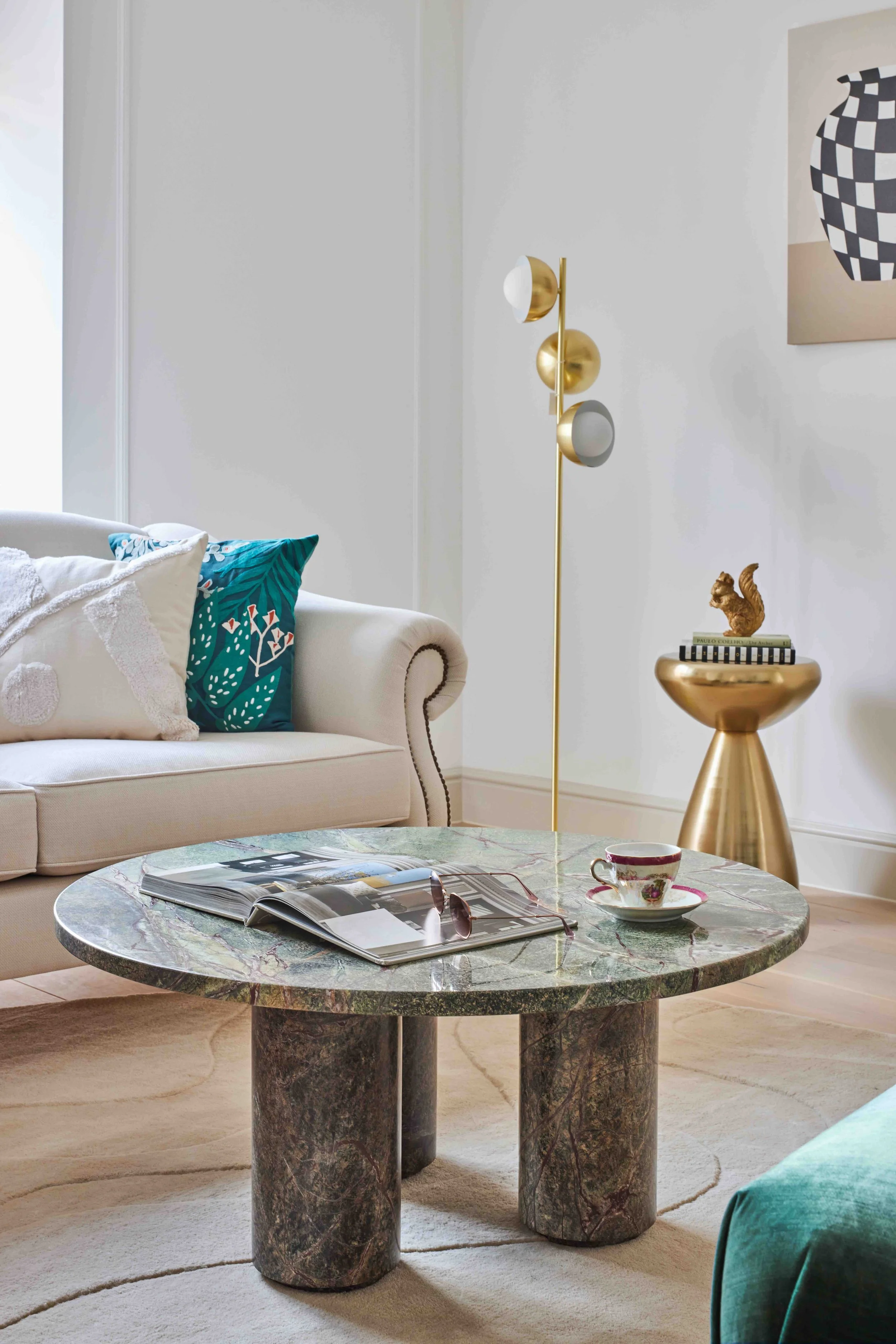 Wimbledon modern living room with marble coffee table, beige sofa, gold floor lamp