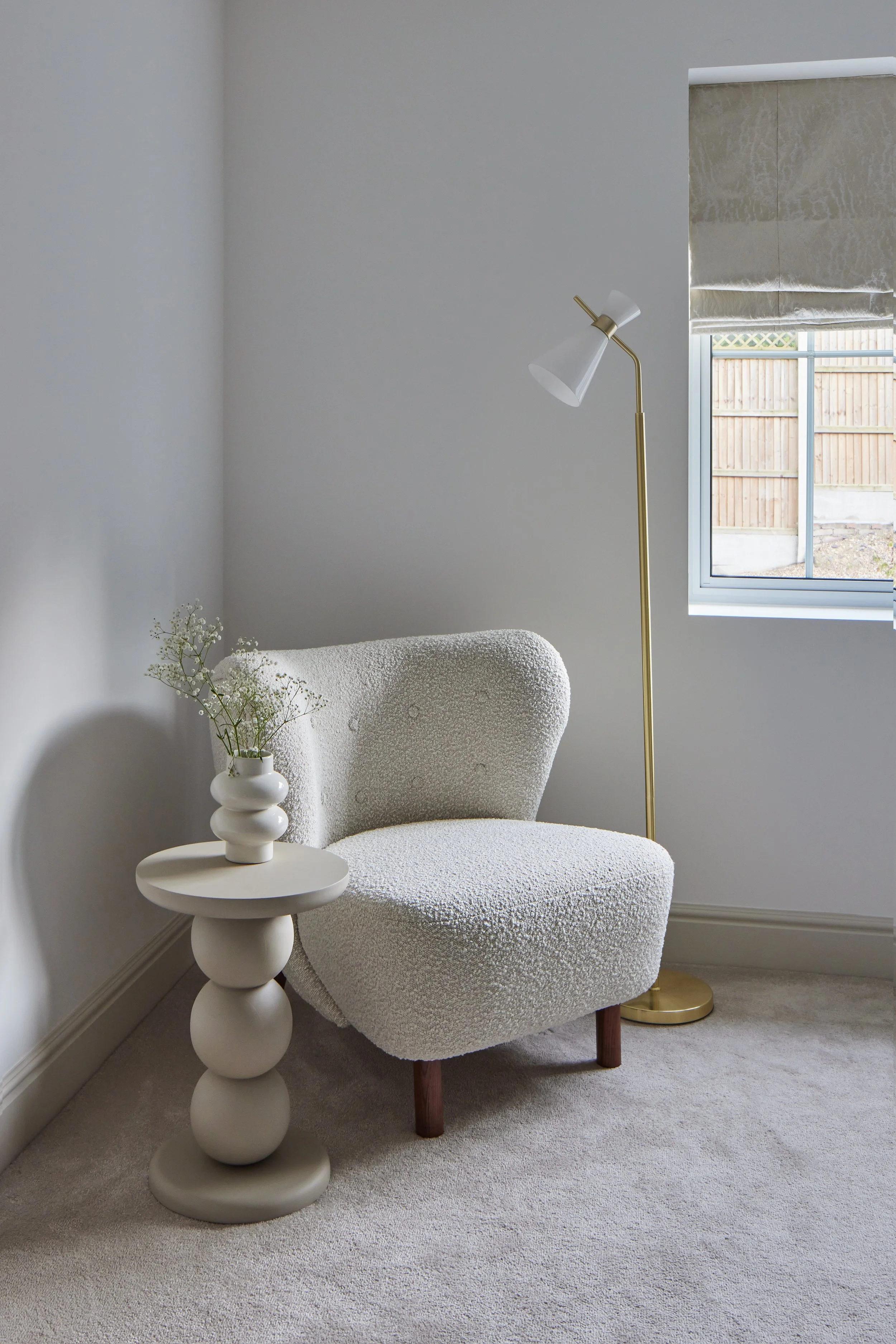 Wimbledon bedroom with beige boucle accent chair and decorative accents