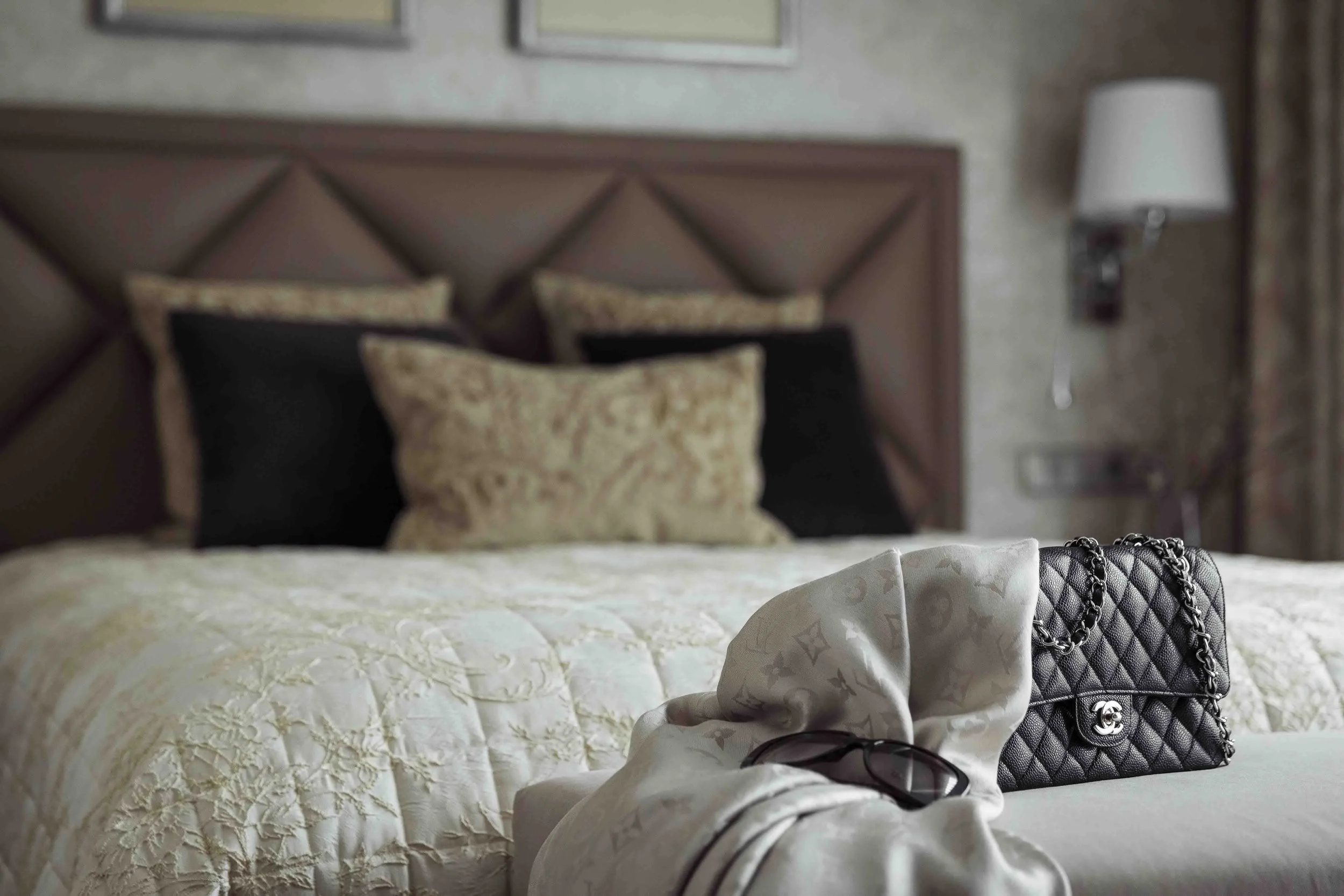 Wimbledon bedroom designed by Mond Design Interiors, featuring Art Deco-inspired style with beige and black bedding.