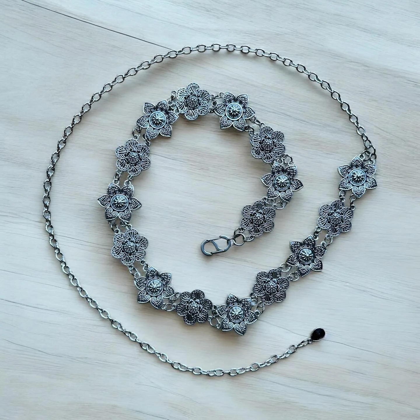 Just listed - Stainless steel chain belt. 24in link section with additional 24in chain to adjust in size. Finished with a heavy duty &ldquo;S&rdquo; clasp and a black teardrop glass gem.