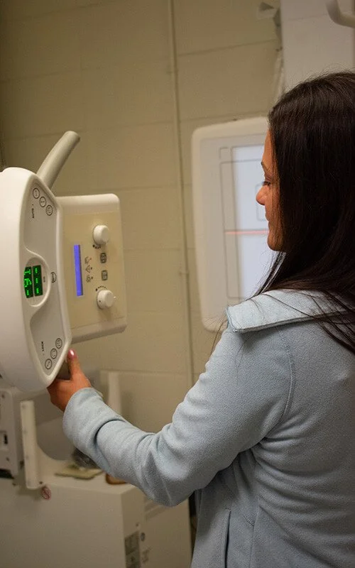 North Runnels Hospital staff member operating digital X-ray equipment for diagnostic imaging services.