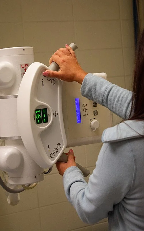 North Runnels Hospital imaging staff member operating X-ray equipment for diagnostic services in Winters, Texas.