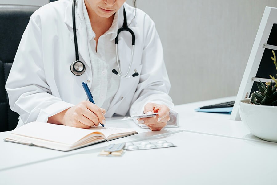 Healthcare provider reviewing patient information, representing attentive medical care at North Runnels Hospital District.