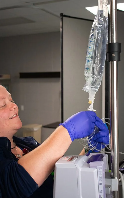 North Runnels Hospital clinical staff preparing IV infusion equipment for safe patient treatment.