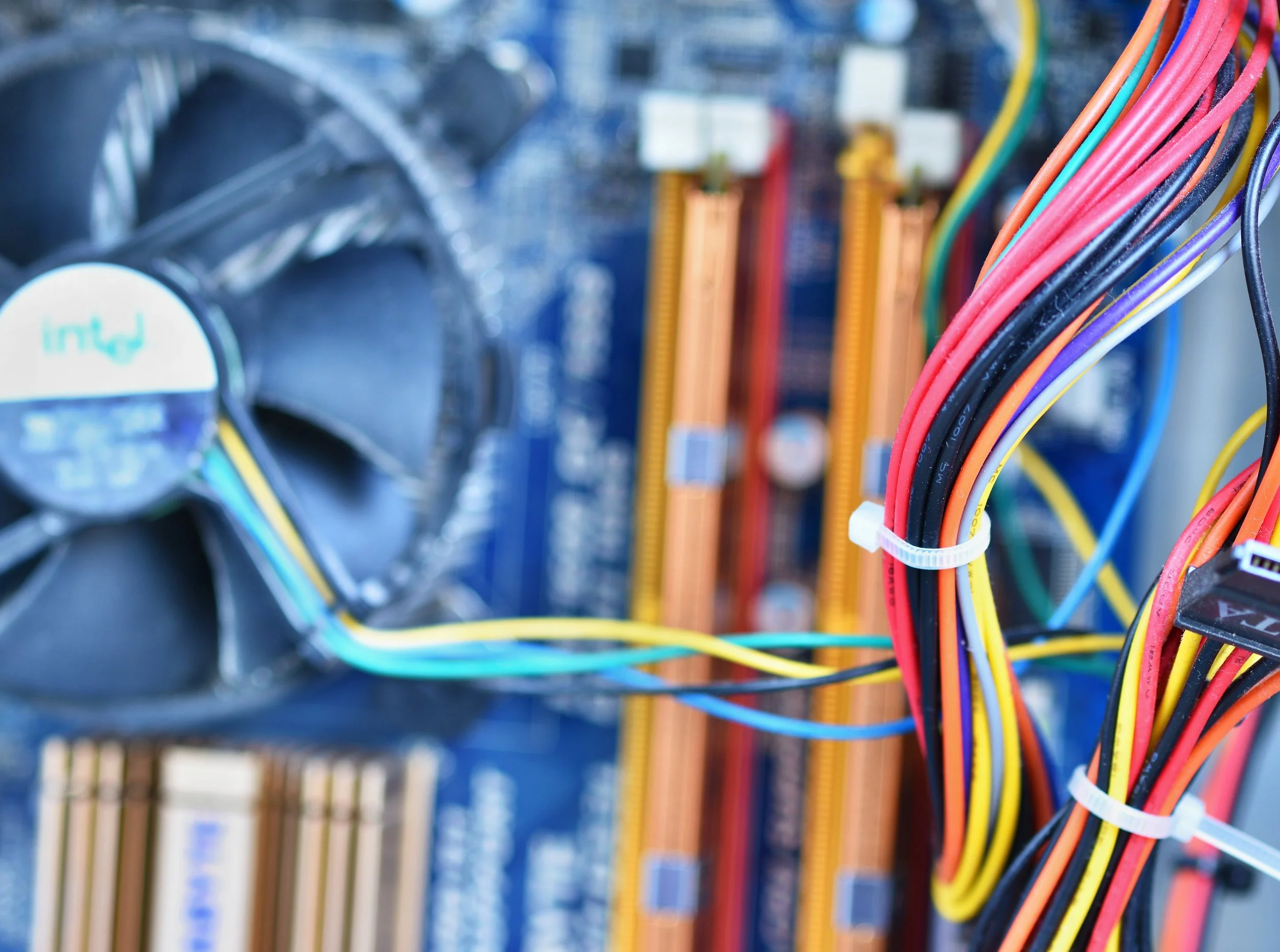 Close-up of multi-coloured power supply cables and other internal components.