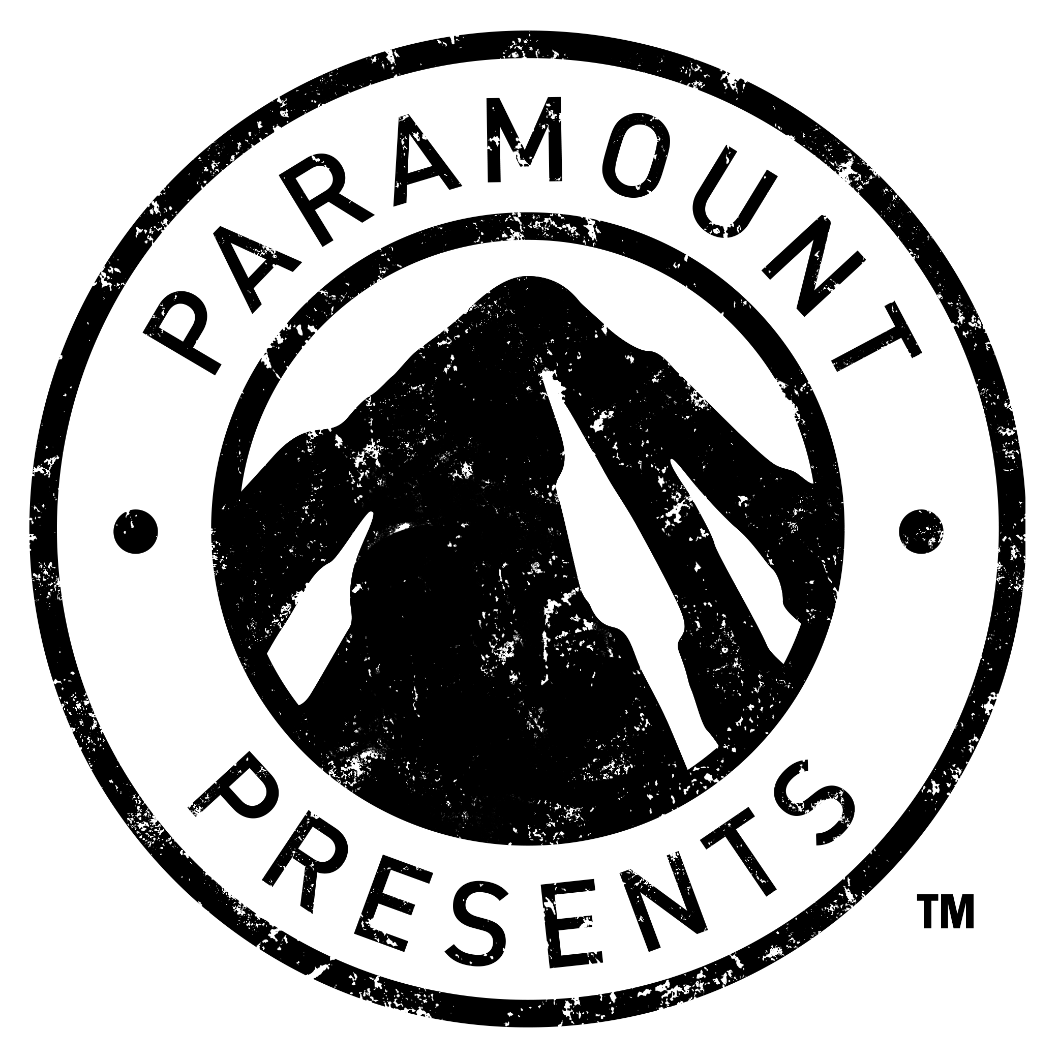Black and white circular logo featuring a mountain silhouette in the center, with the words 'PARAMOUNT PRESENTS' around the top and bottom edges, in a distressed font.