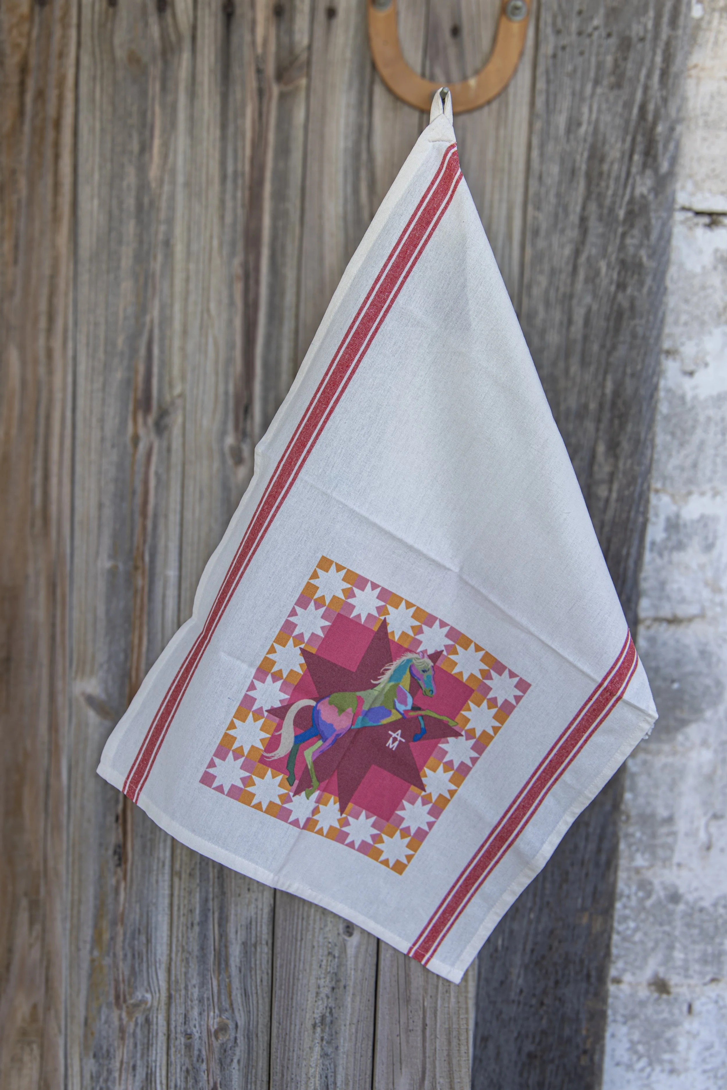Tea towel hanging with a picture of a colorful horse