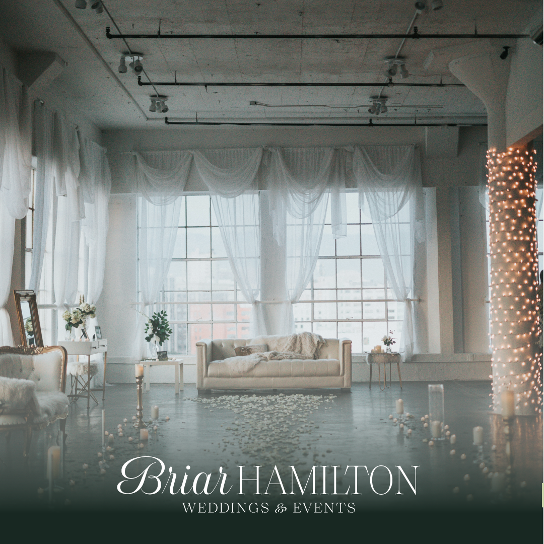 Elegant wedding venue with white curtains, sofa, rose petals, and candles. Displayed "Briar Hamilton Weddings & Events" text.