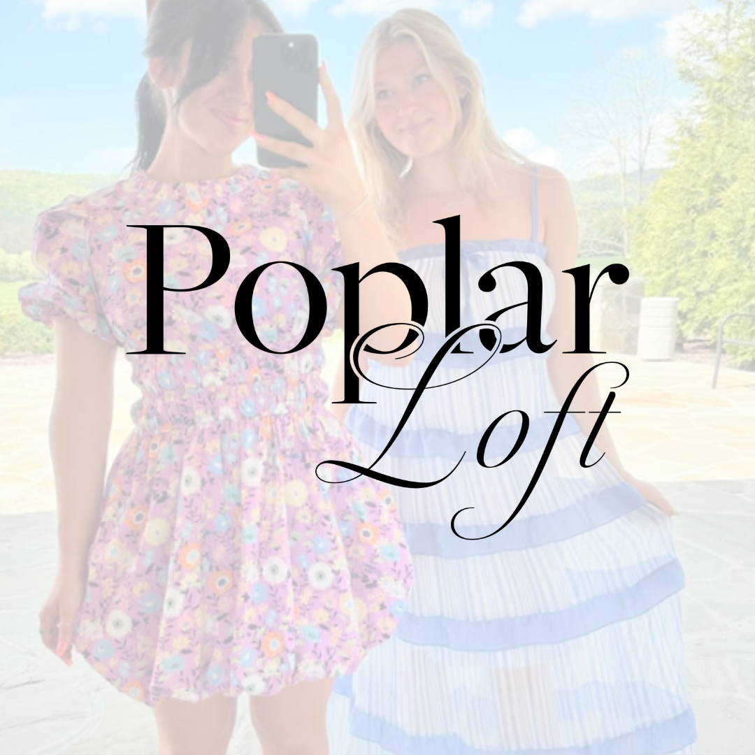 Two women in floral and striped dresses, taking a selfie outdoors; "Poplar Loft" text overlay.