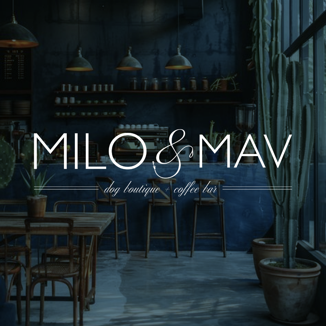 Interior of Milo & Mav dog boutique and coffee bar with rustic decor and greenery.