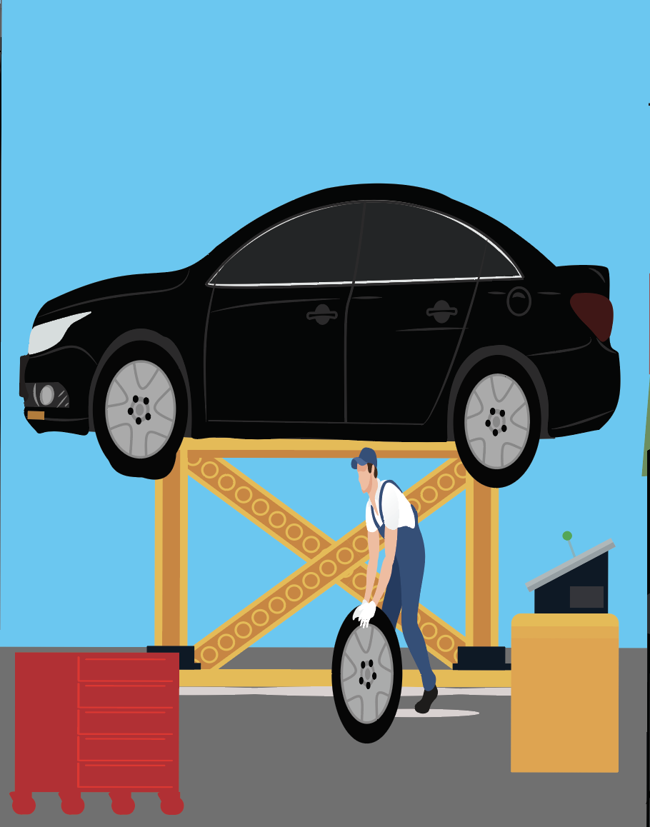 A car on a hydraulic lift being serviced by a mechanic. The mechanic is holding a tire, and there is a monitor and a red tool chest nearby.