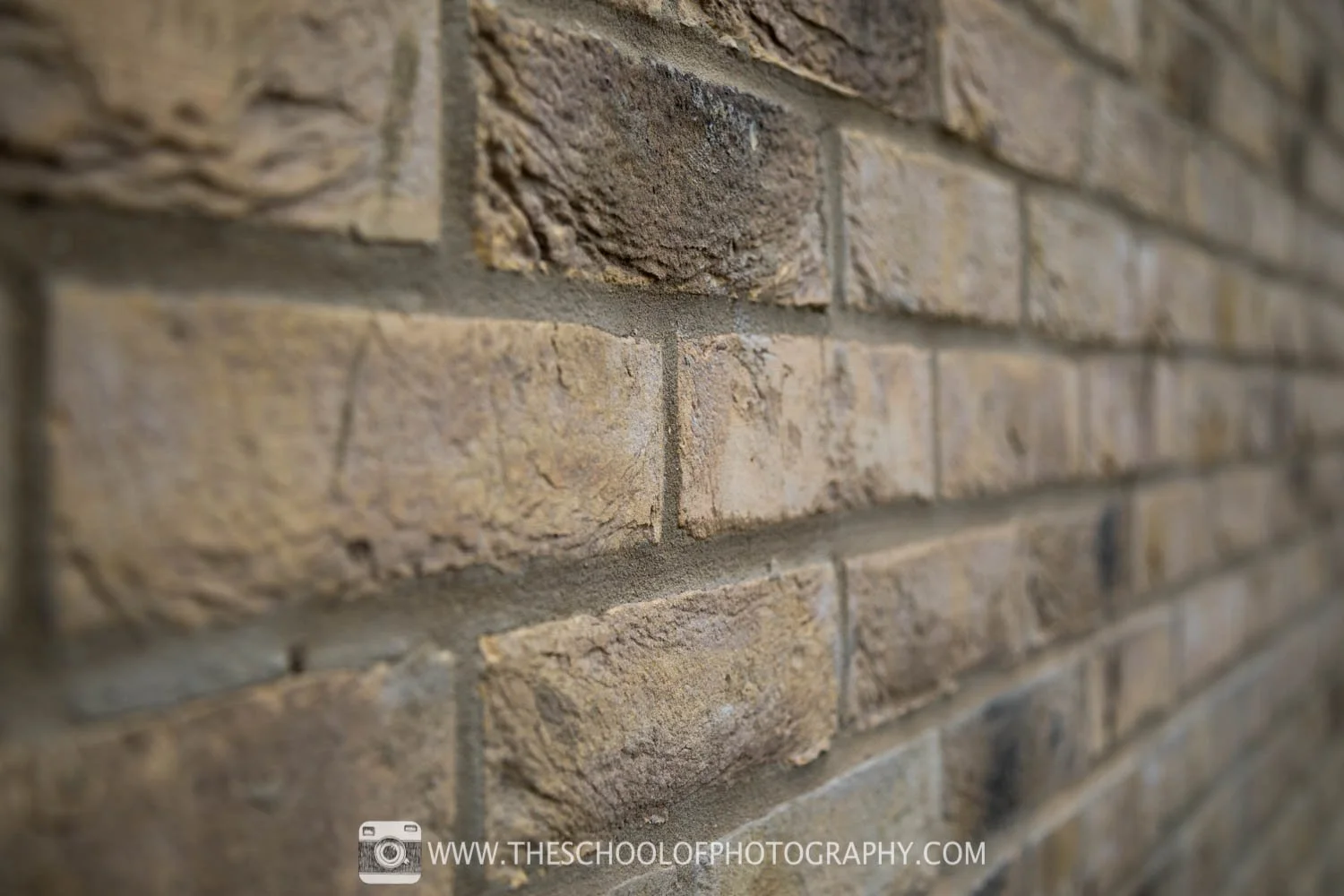 An example image of a brick wall, with a f/4 aperture setting showing narrow depth of field