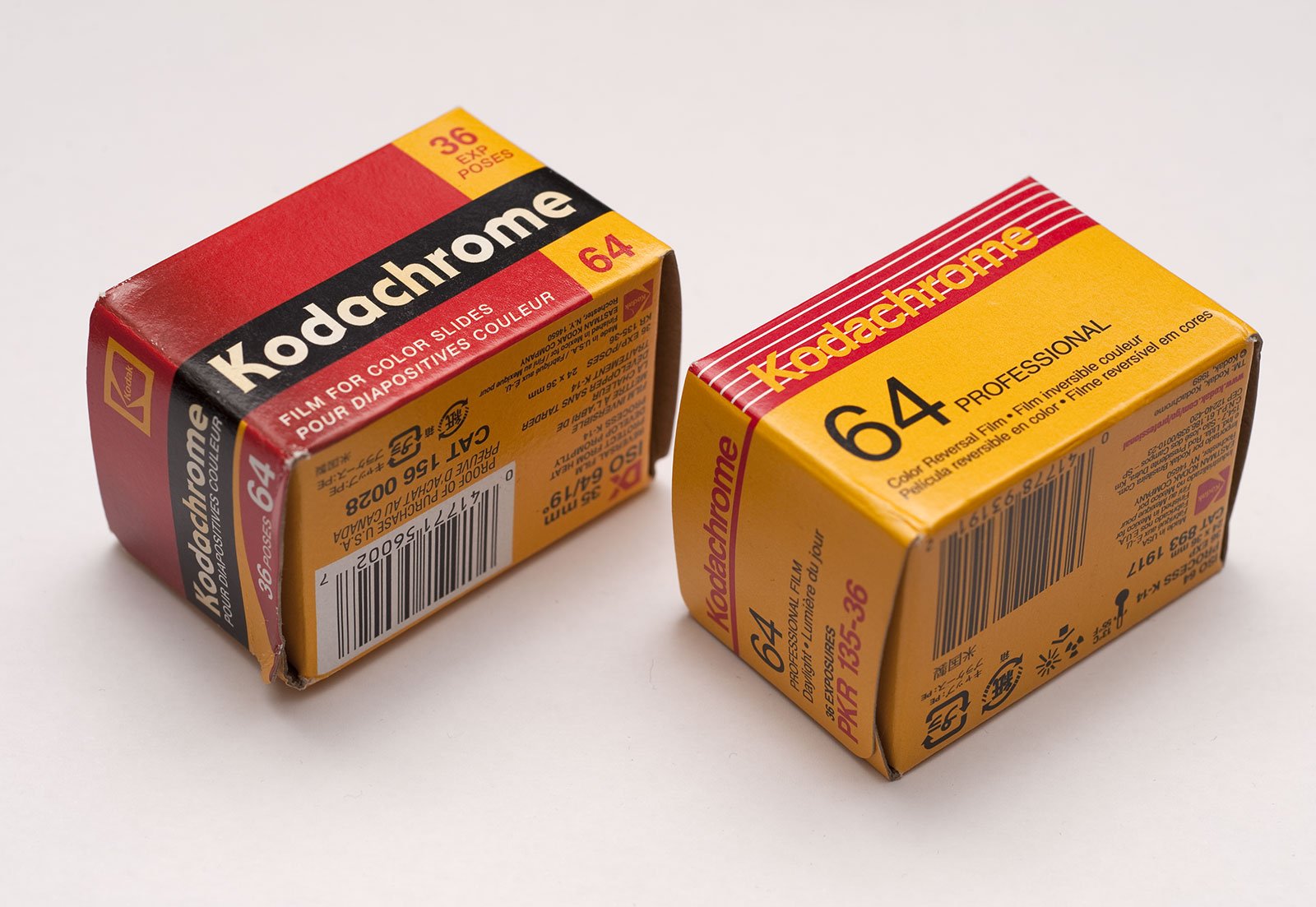 Two boxes of Kodak Kodachrome 64 colour slide film, showing the distinctive red and yellow packaging of the classic analogue photography film.