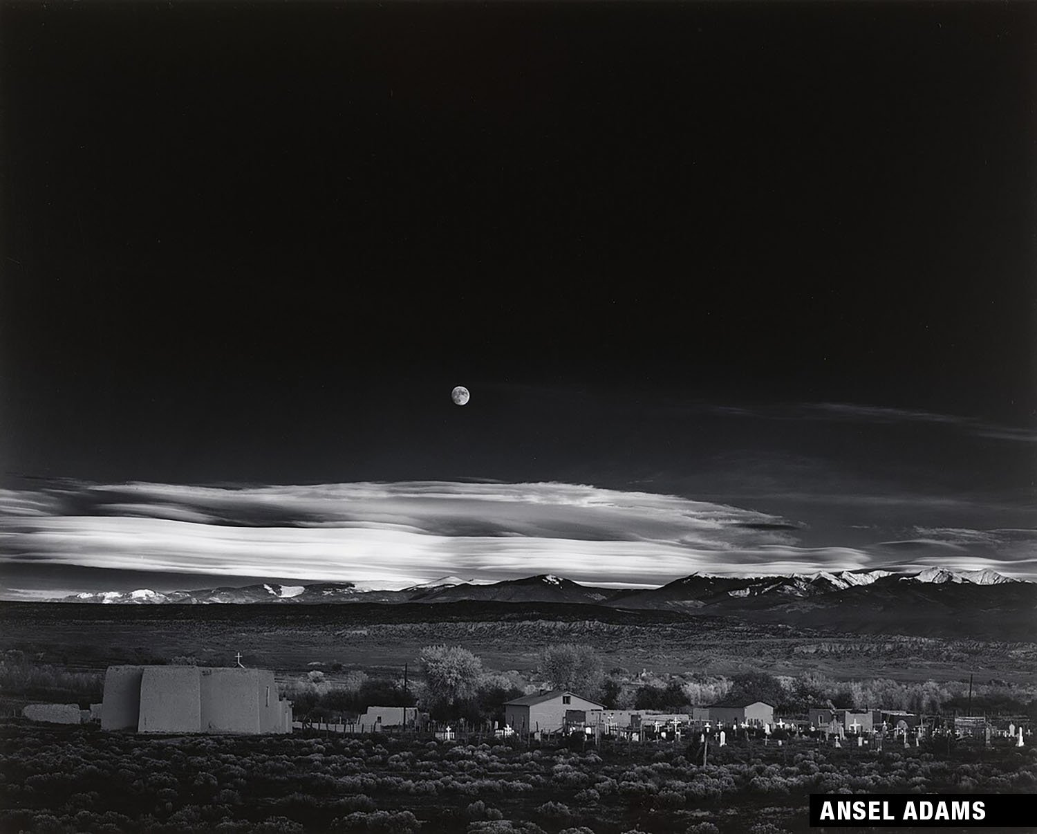 Black and white photograph: Moonrise over Hernandez, New Mexico, by Ansel Adams.
