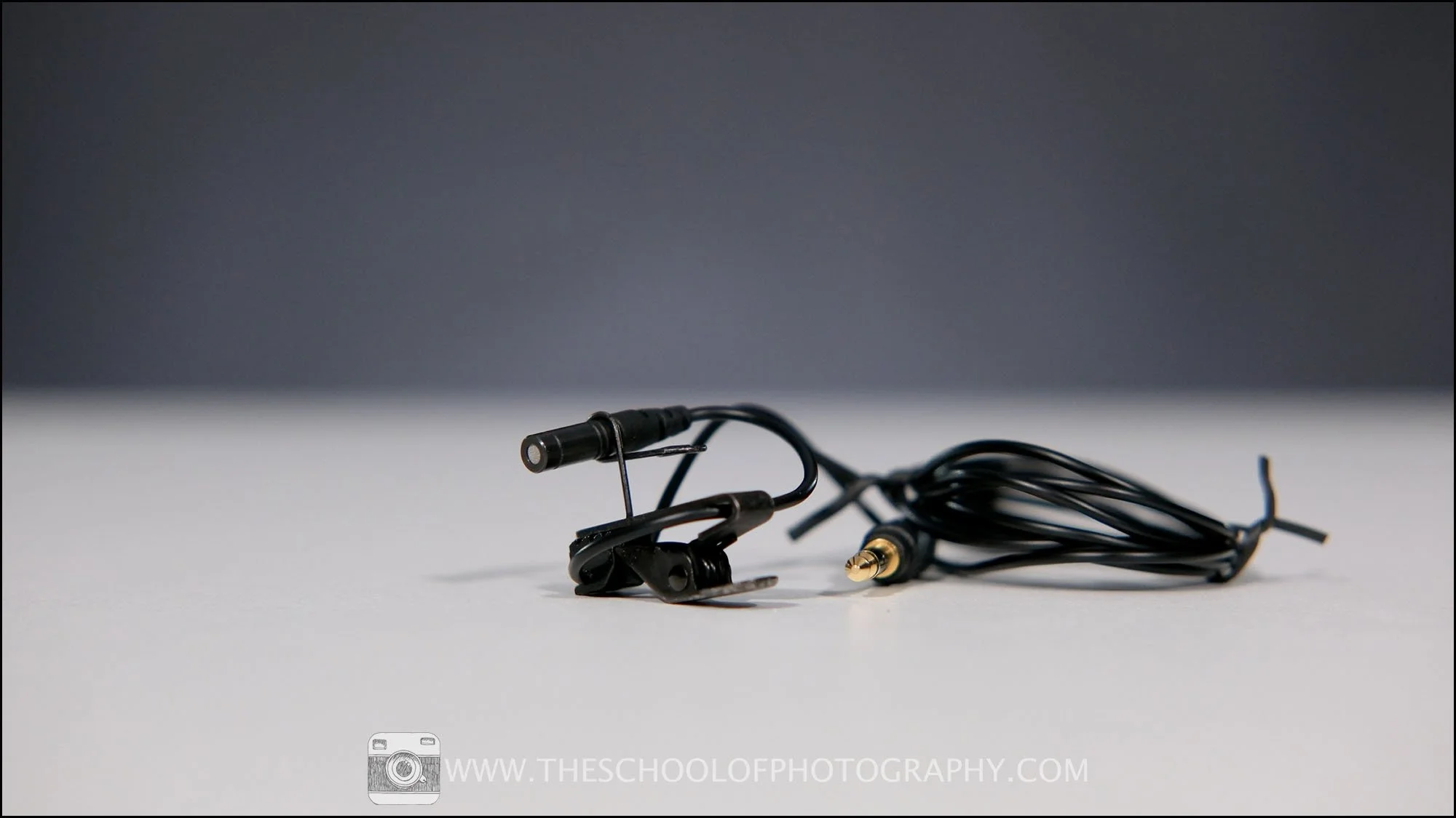Lavalier clip-on microphone with cable and 3.5mm jack, used for recording clear dialogue in video production.