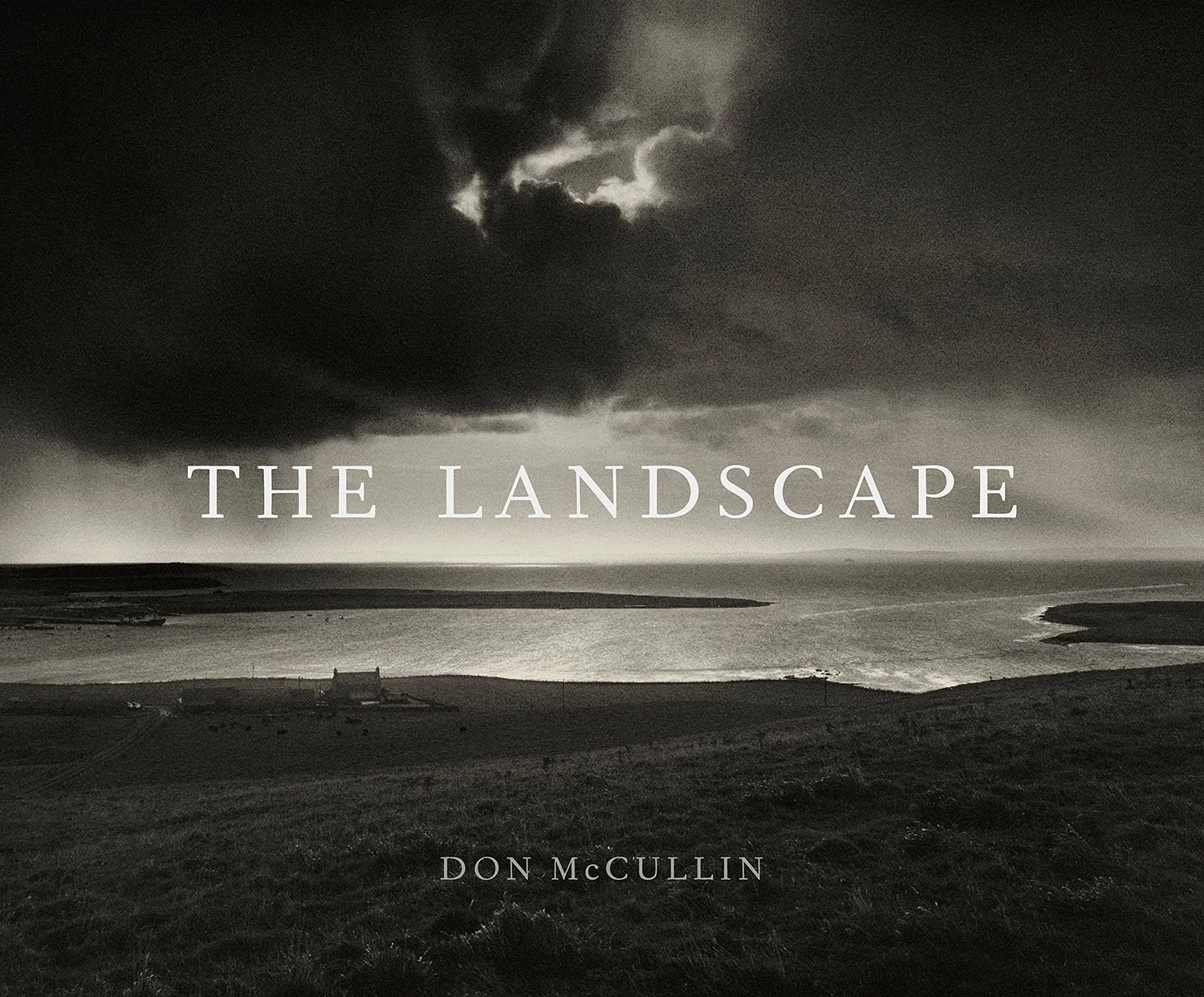 The Landscape book cover by Don McCullin, featuring a dramatic, moody black and white seascape.