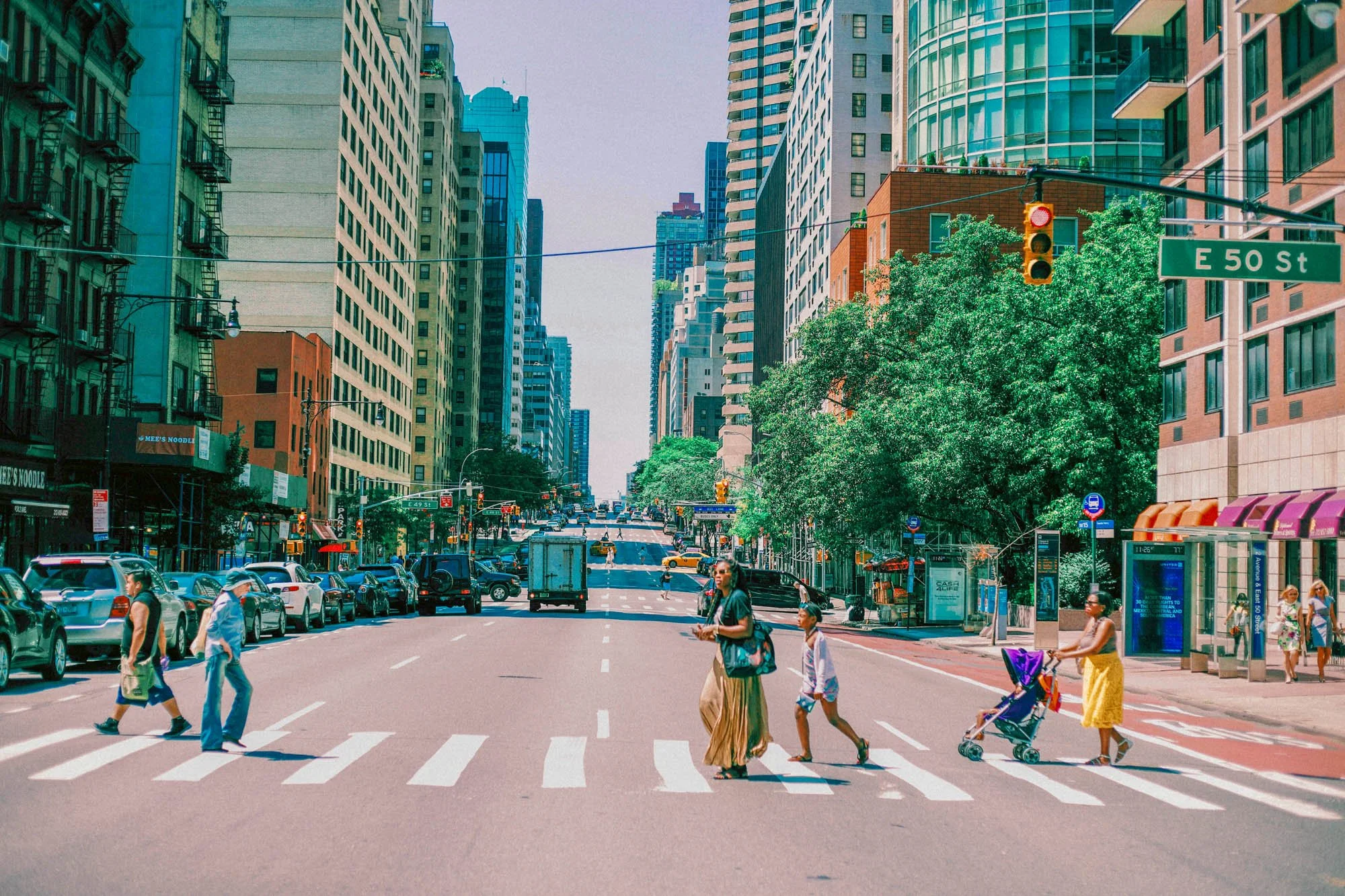 New York street scene with people crossing at a crosswalk in a photo after using Lightroom film presets