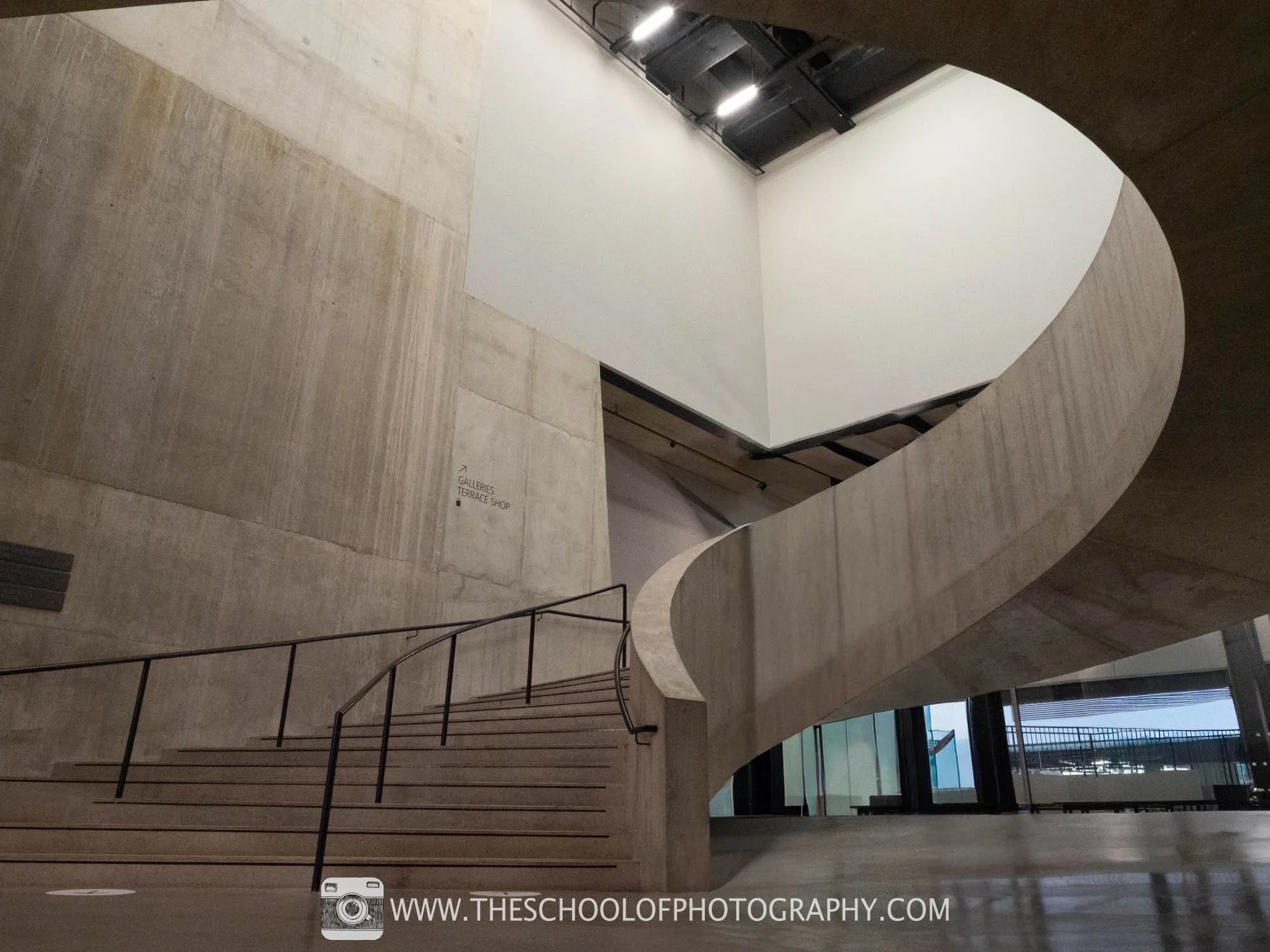 After image showing an empty concrete spiral staircase after people removal.