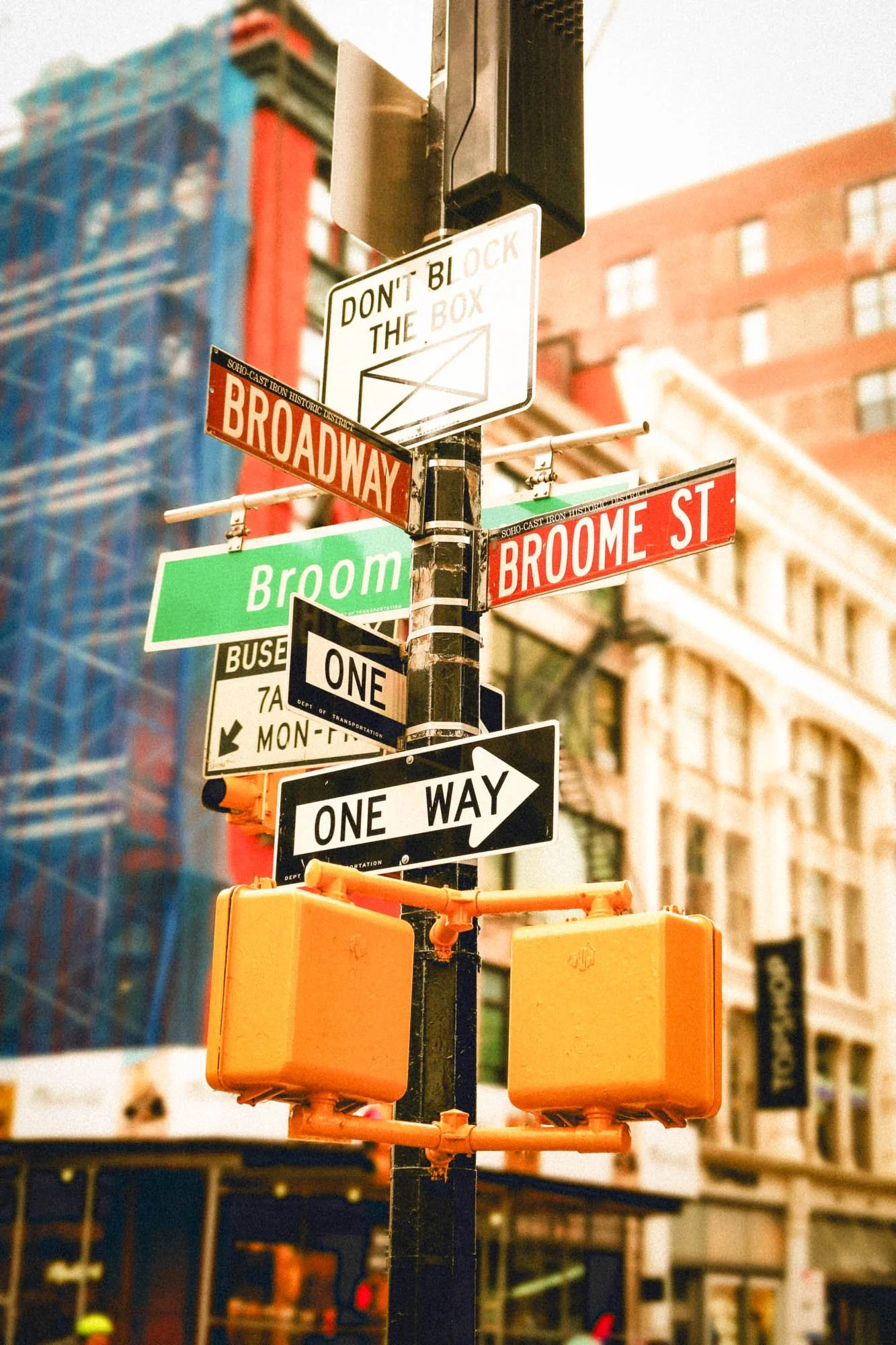 New York street signs at Broadway and Broome Street in a photo after using free Lightroom film presets.