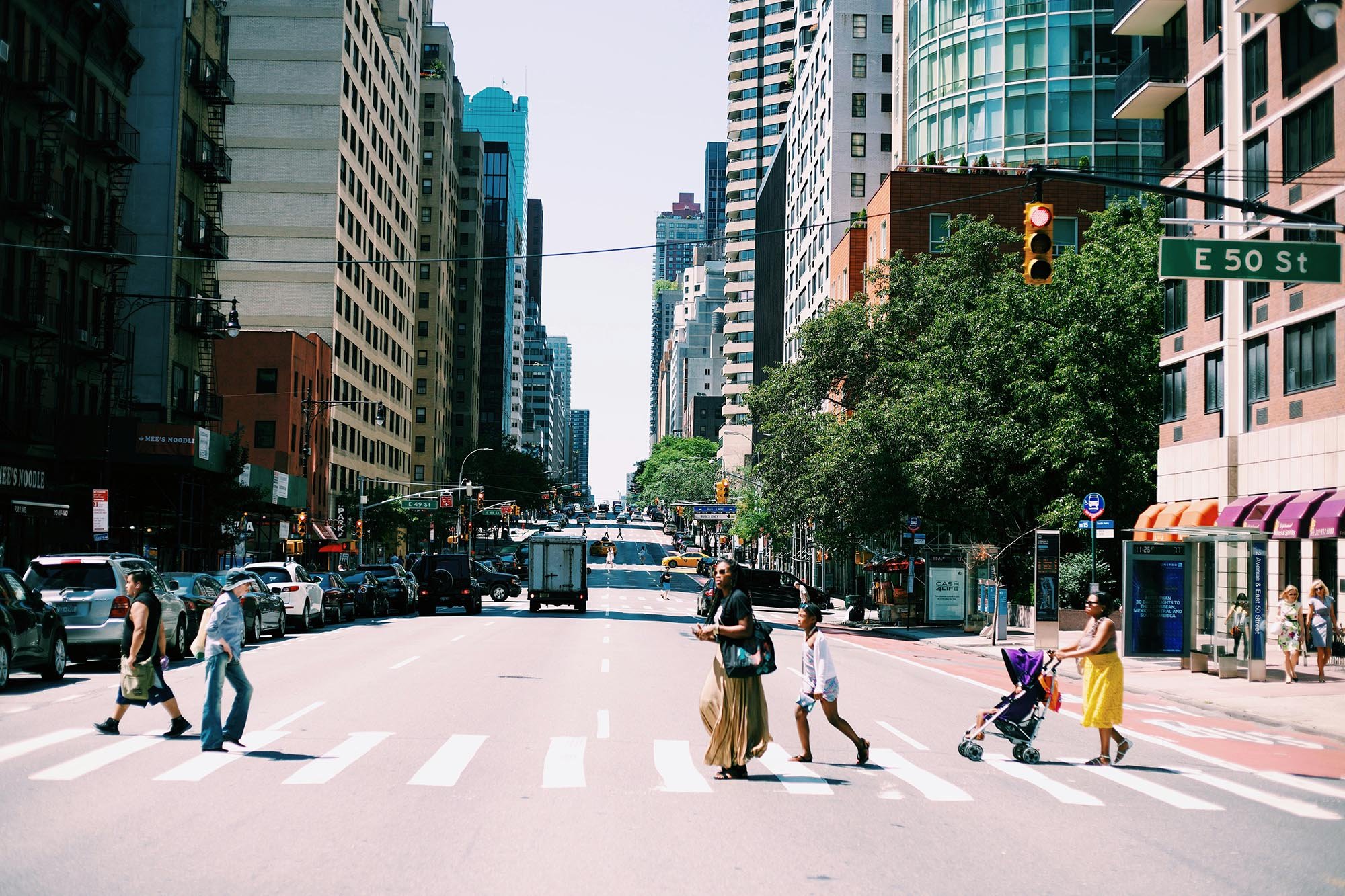 New York street scene with people crossing at a crosswalk in a photo before using Lightroom film presets