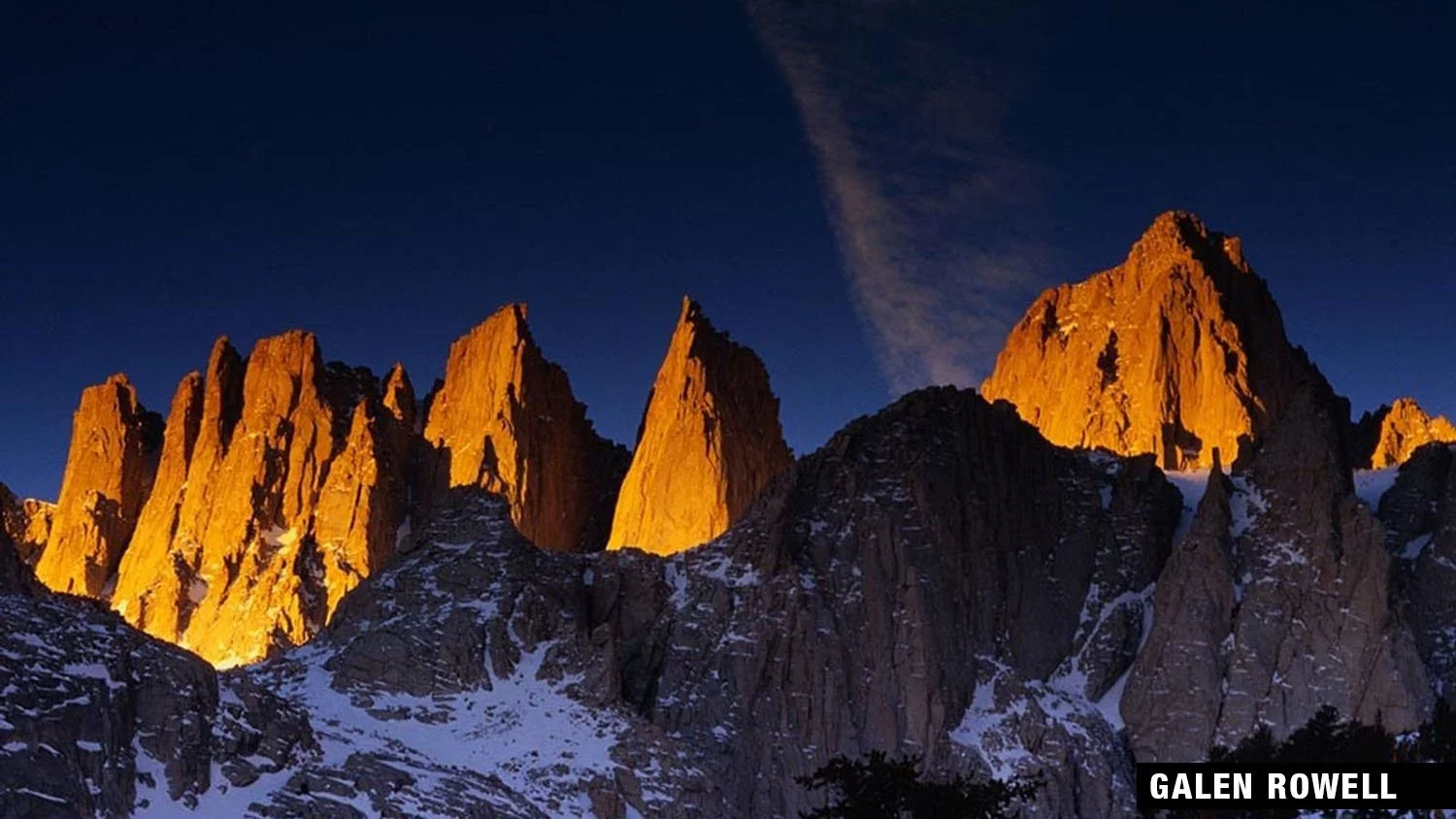 Sierra Nevada peaks glowing golden at sunset, captured by Galen Rowell.