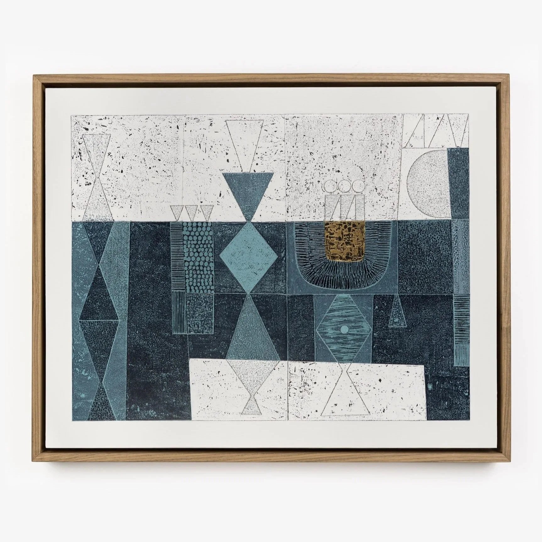 Abstract geometric artwork featuring various shapes and patterns in shades of blue, black, white, and gold, framed in a wooden frame.