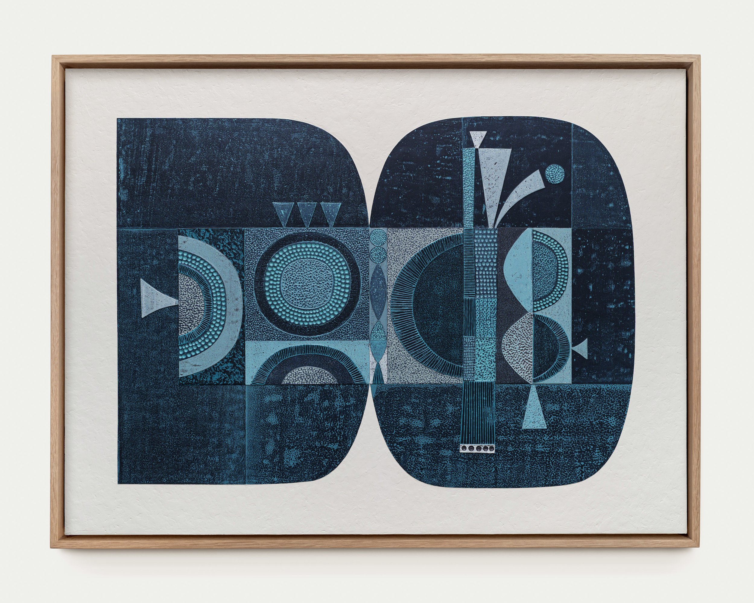 Abstract geometric artwork with blue and black shapes, circles, and patterns framed in light wood.