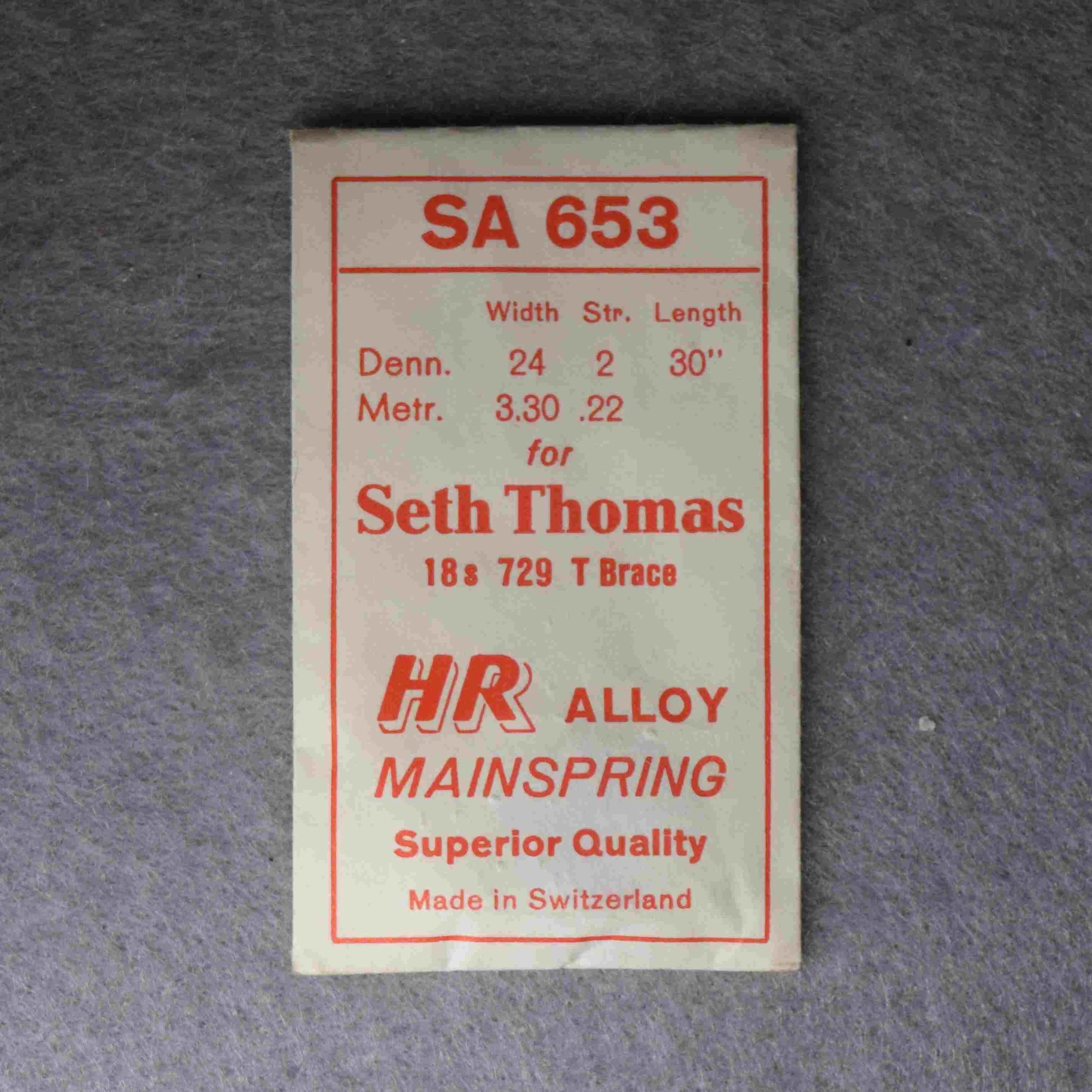 HR Alloy Mainspring Package No. SA 653 – for Seth Thomas 18-size Factory No. 729 T Brace, 30 inches long, 3.30 millimeters wide, 0.22 thick, or, 24 wide, 2 thick Dennison gauge - Made in Switzerland