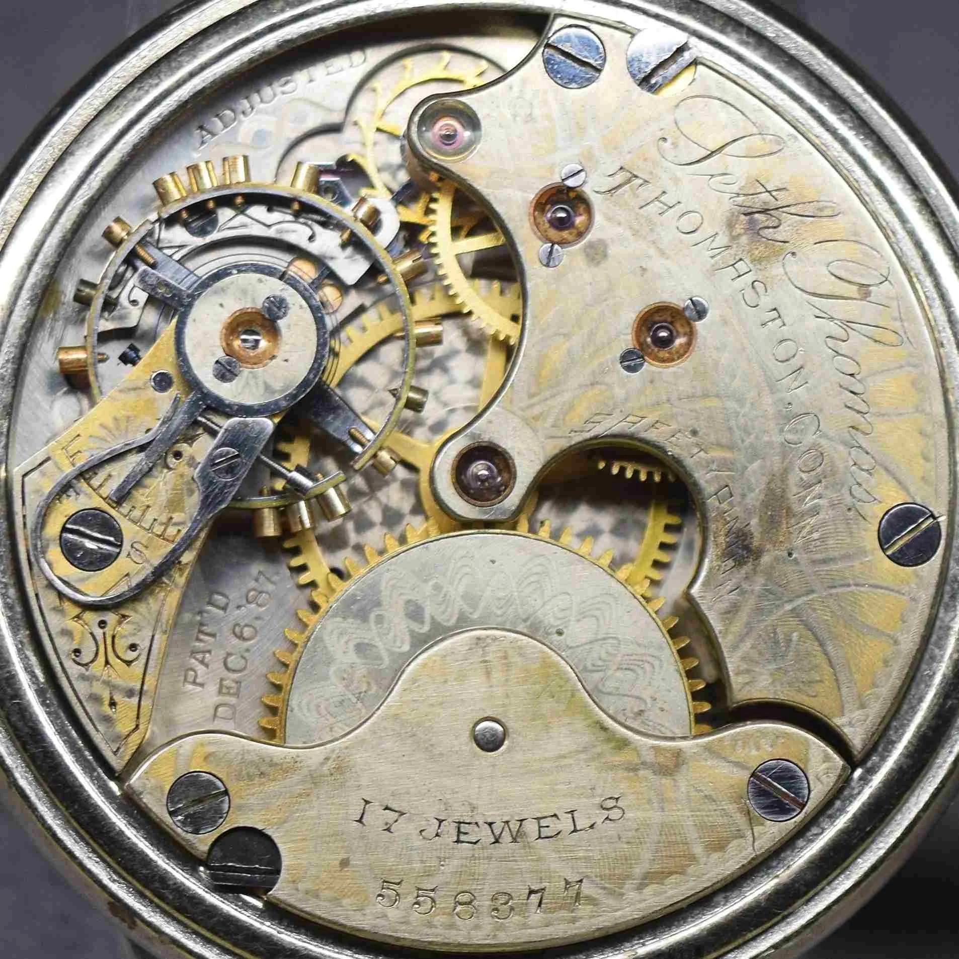 This photograph shows a high definition full diameter close up view of the movement’s top plate.
