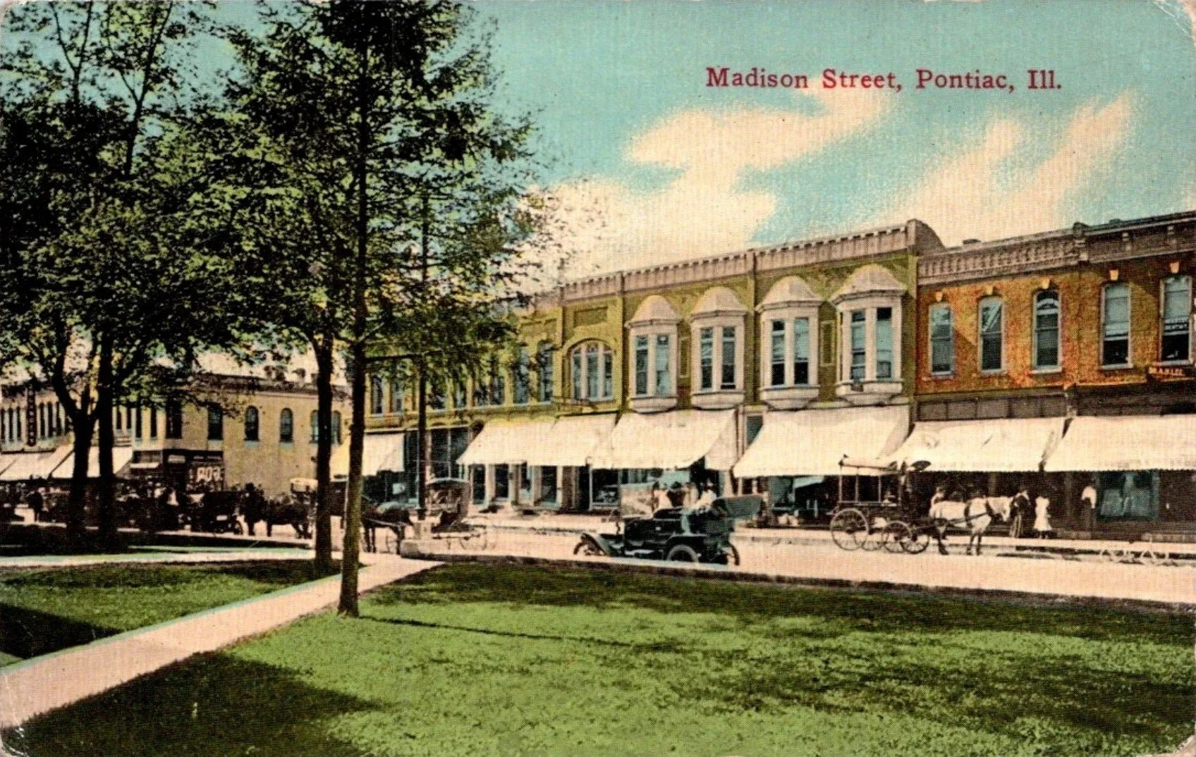 Postcard photograph also shows McGregor & Sons Store on W. Madison Street in Pontiac, Illinois from the opposite direction as the first postcard.