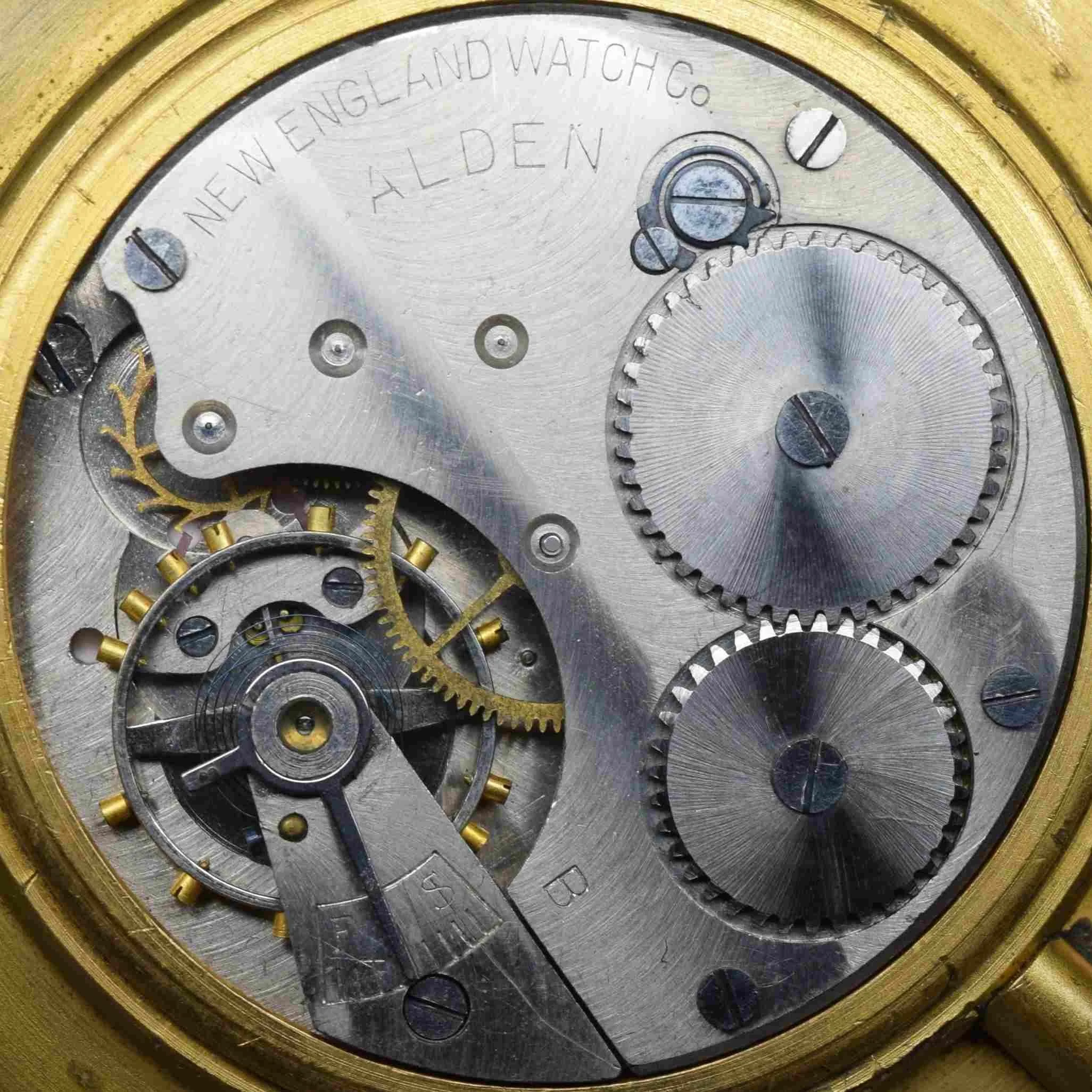 This photograph shows a high definition full diameter close up view of the movement’s top plate.