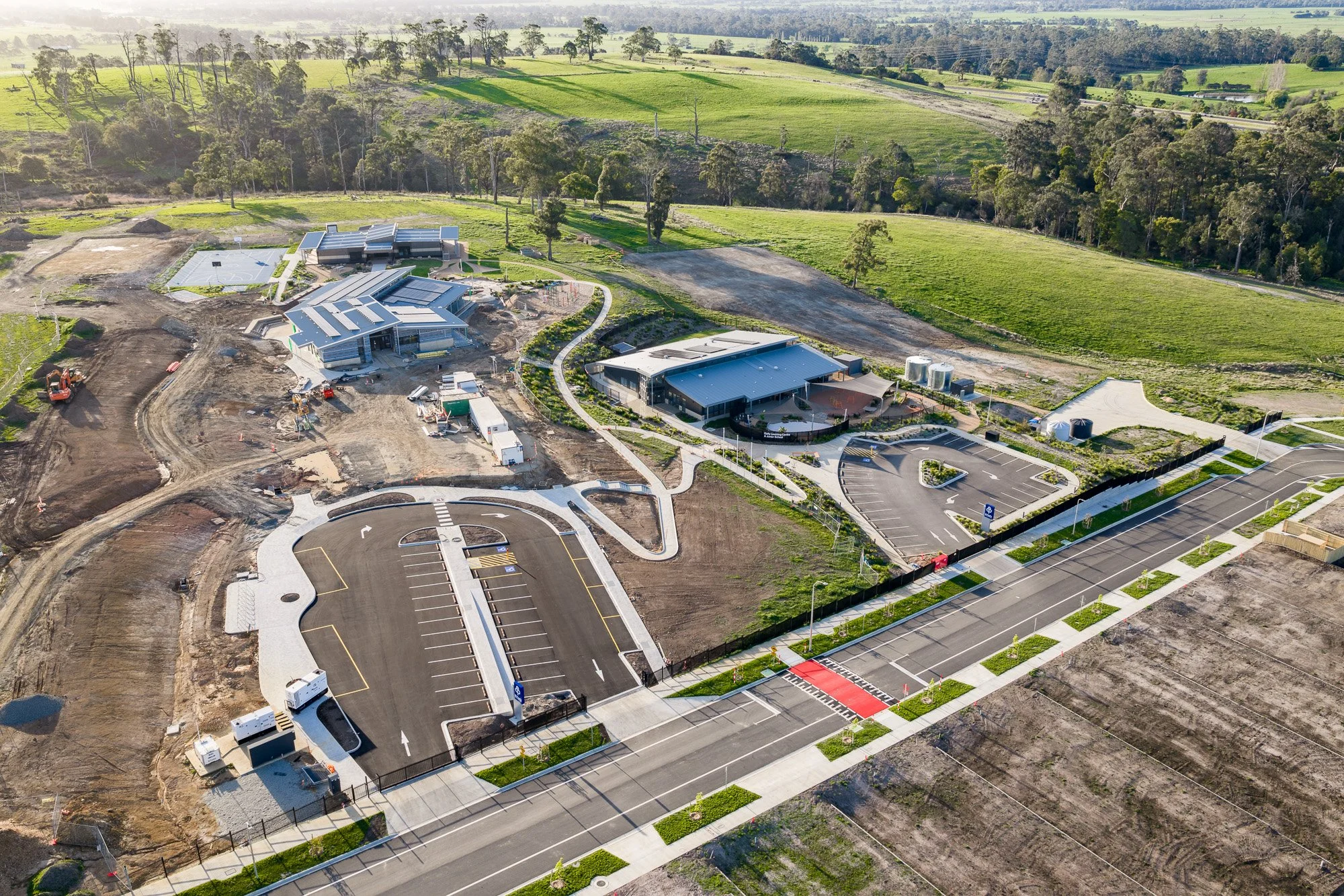 Construction photography Gippsland estate development aerial showing completed roads, site layout and school construction