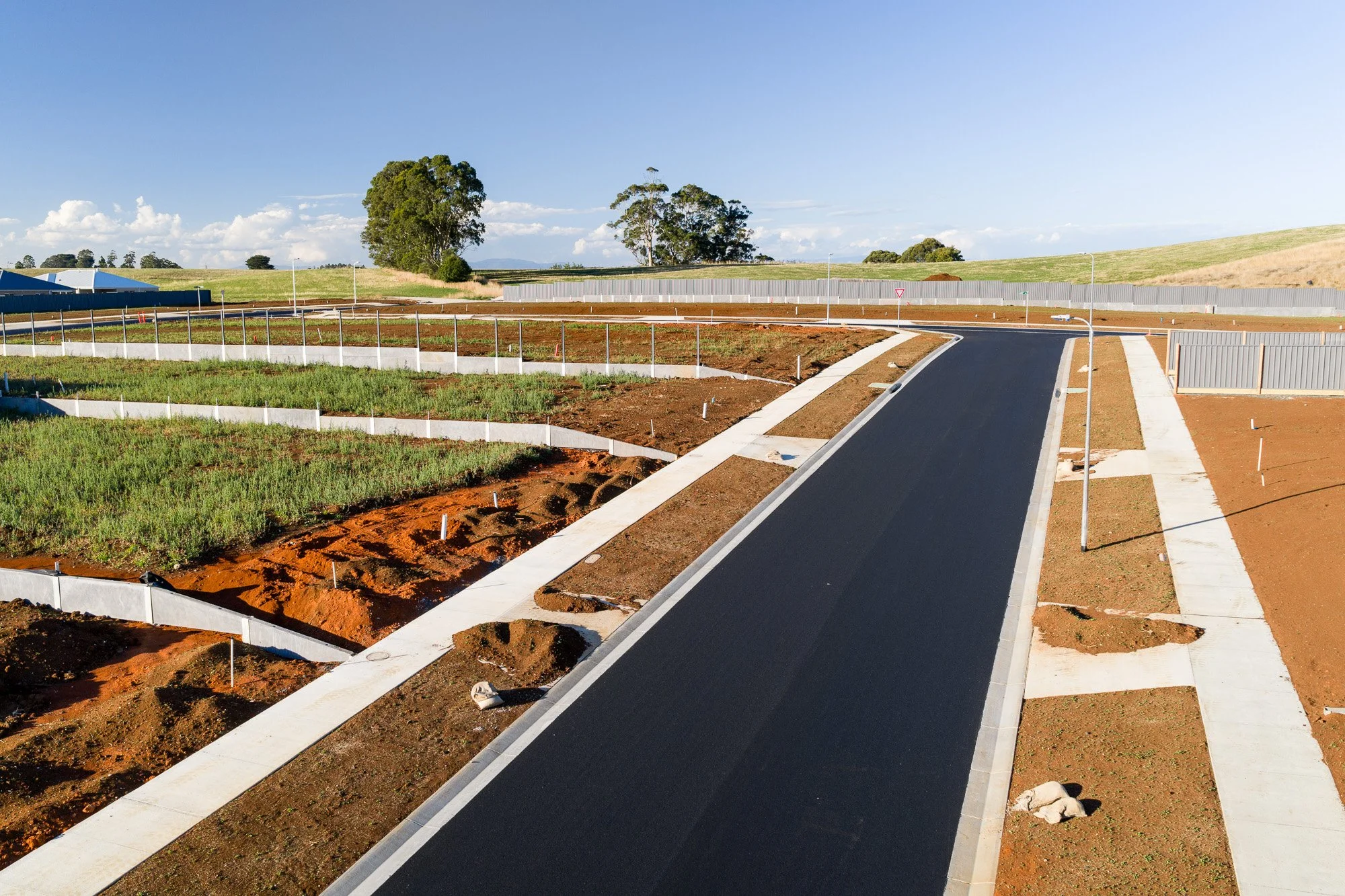 Construction photography Latrobe Valley newly completed asphalt road and subdivision layout