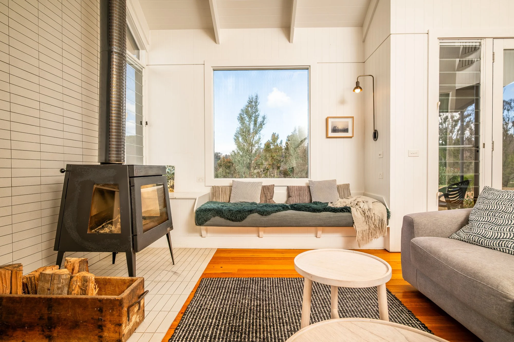 Interior accommodation photography featuring a fireplace and living area in Bass Coast, Victoria