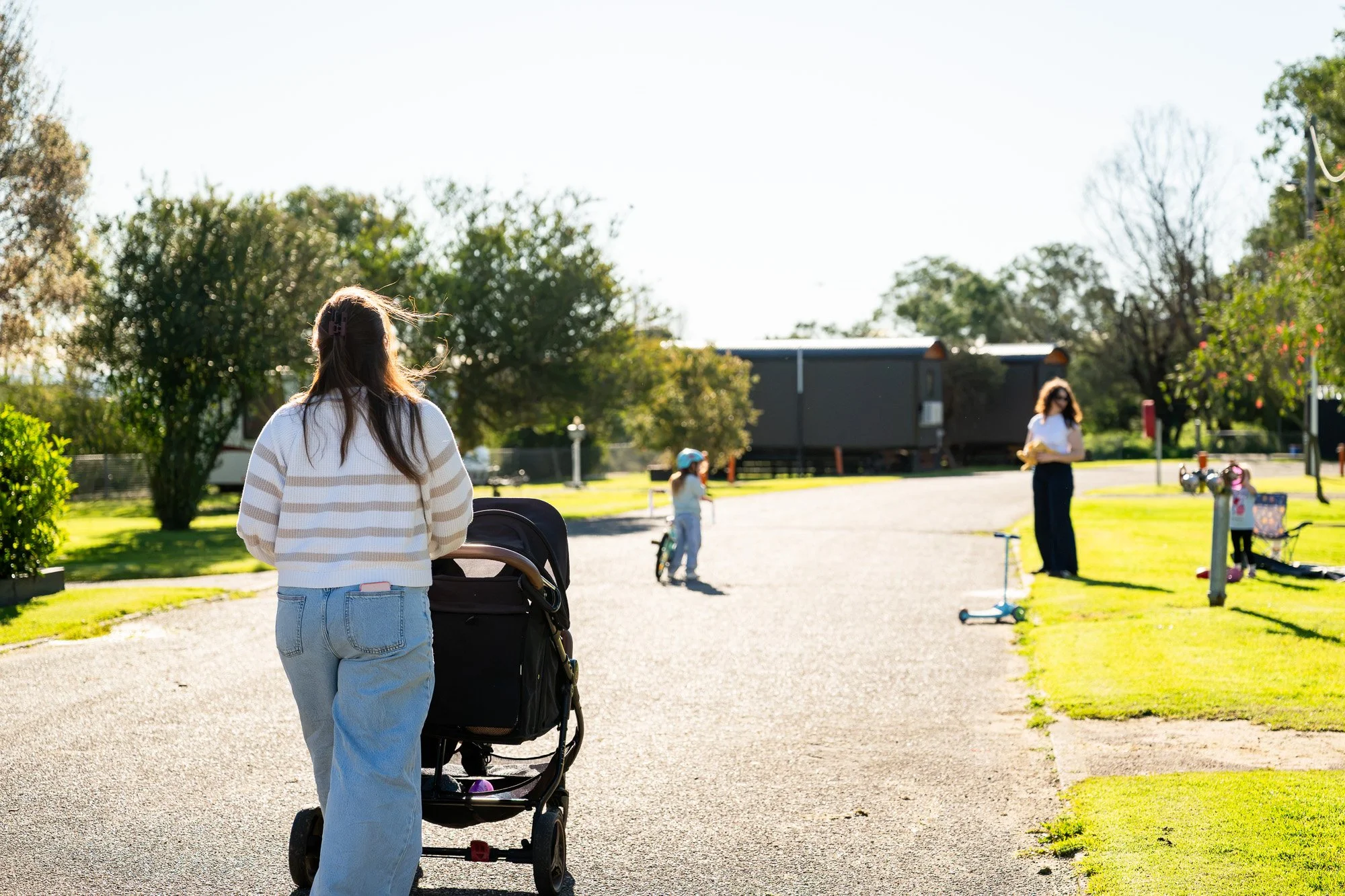 Photographing family enjoying the grounds of a Gippsland holiday park during their stay