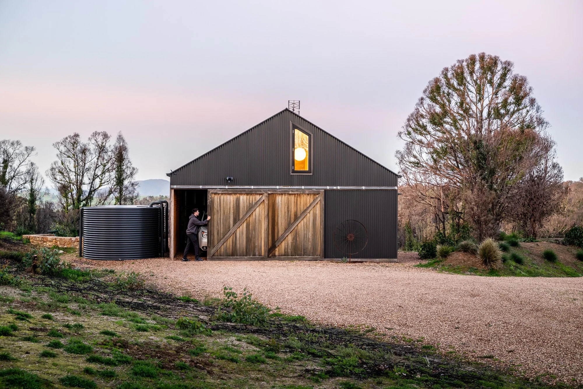 Airbnb photography of a modern barn-style accommodation at dusk in the Victorian countryside