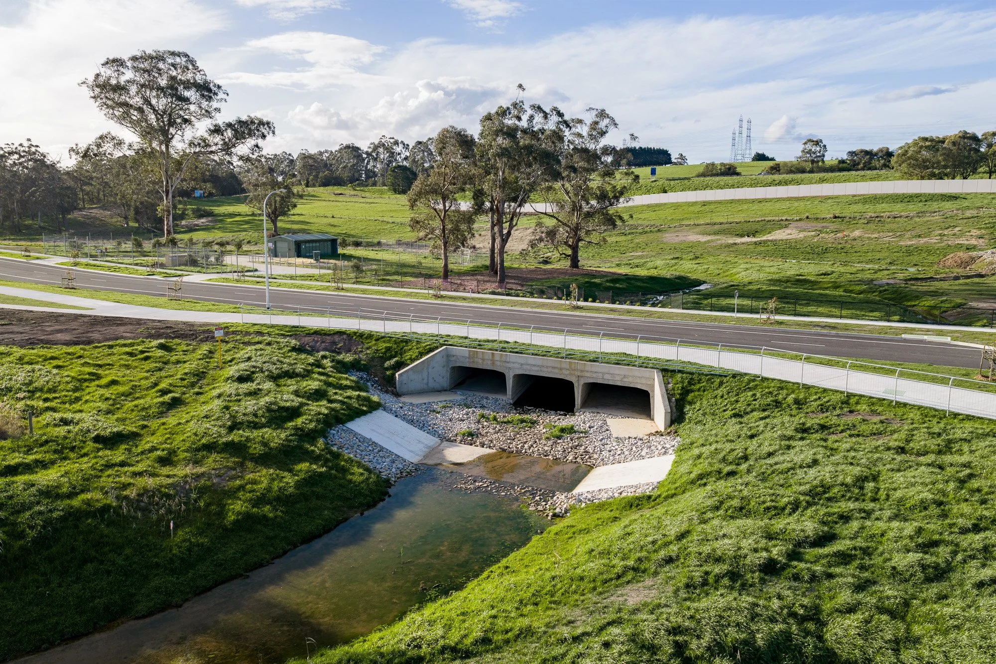 Construction photography civil drainage infrastructure with bridge and waterway crossing