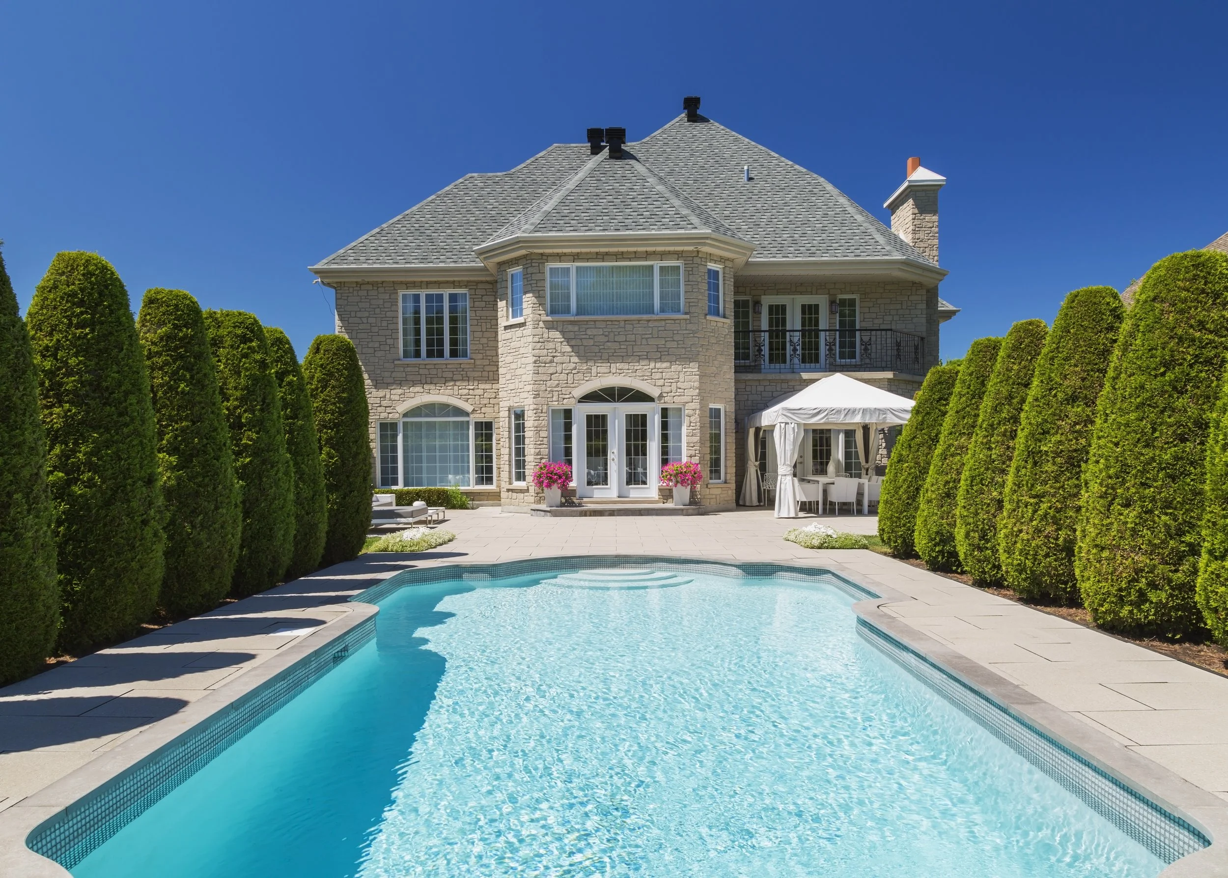 outdoor-swimming-pool-bordered-by-rows-of-cedar-tr-2024-10-18-08-42-52-utc.jpg