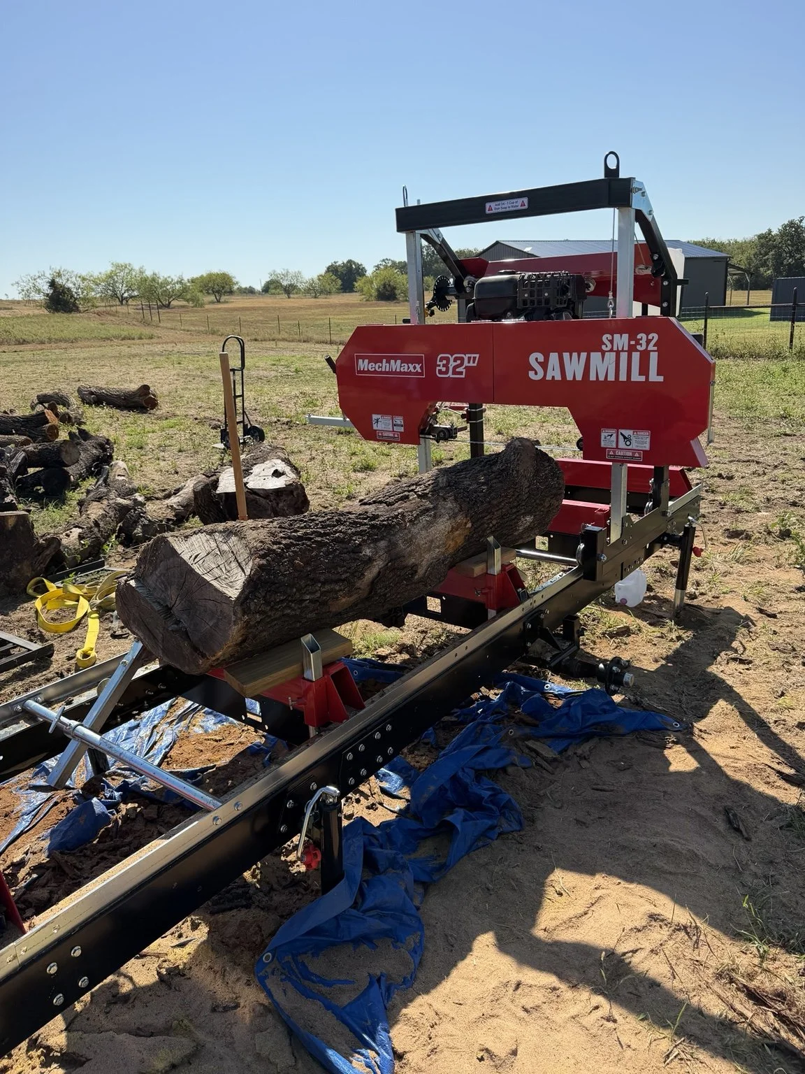 Local hardwood log loaded on the Liberty Woodworks MechMaxx SM-32 sawmill