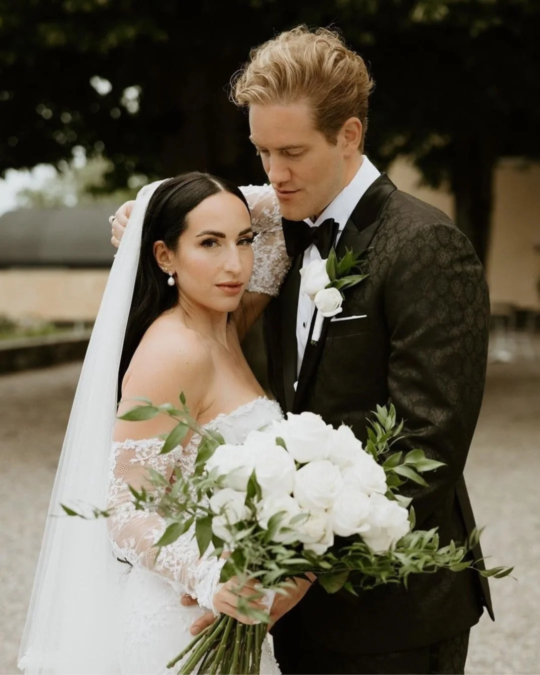 Visuals that leave an imprint from a wedding day don&rsquo;t have to be the loudest or boldest in the room -

For these two, it was in the soft details. 

A heartfelt photo locket added to the bouquet, the bride&rsquo;s unforgettable lace sleeves, th