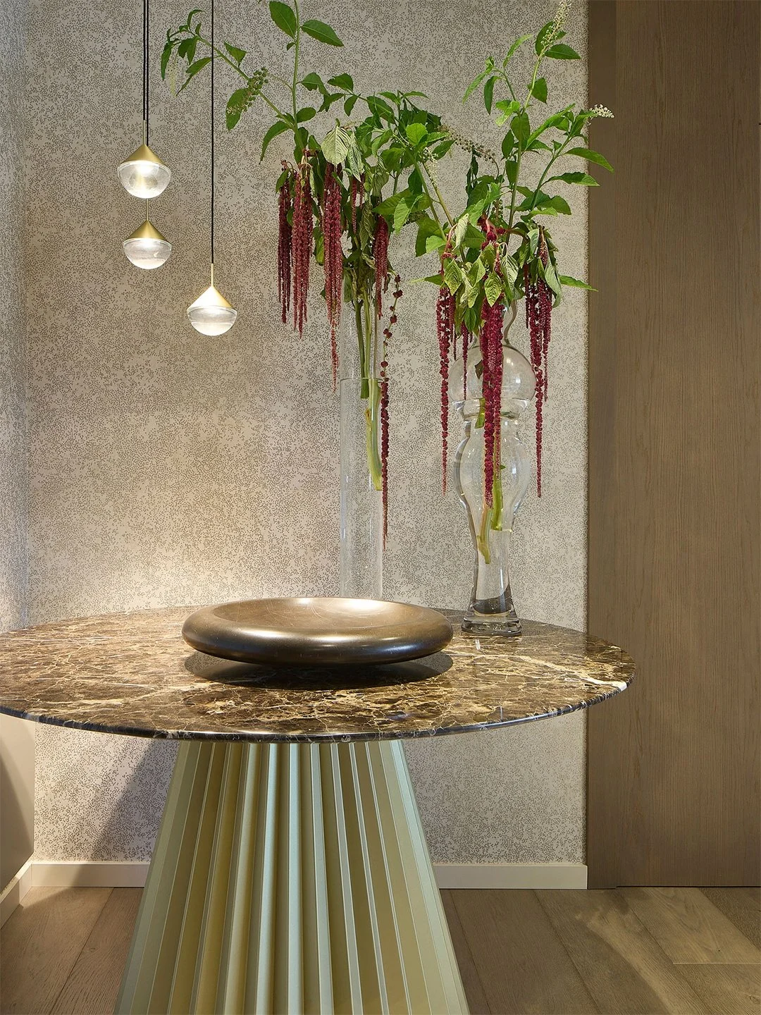 Some spaces don&rsquo;t need to speak loudly to be unforgettable. 

In Amelia Apartment, we wanted the entryway to feel like a pause: focused warm lighting, a textured wall, embracing wood, and a sculptural piece grounding the whole composition.

Bec