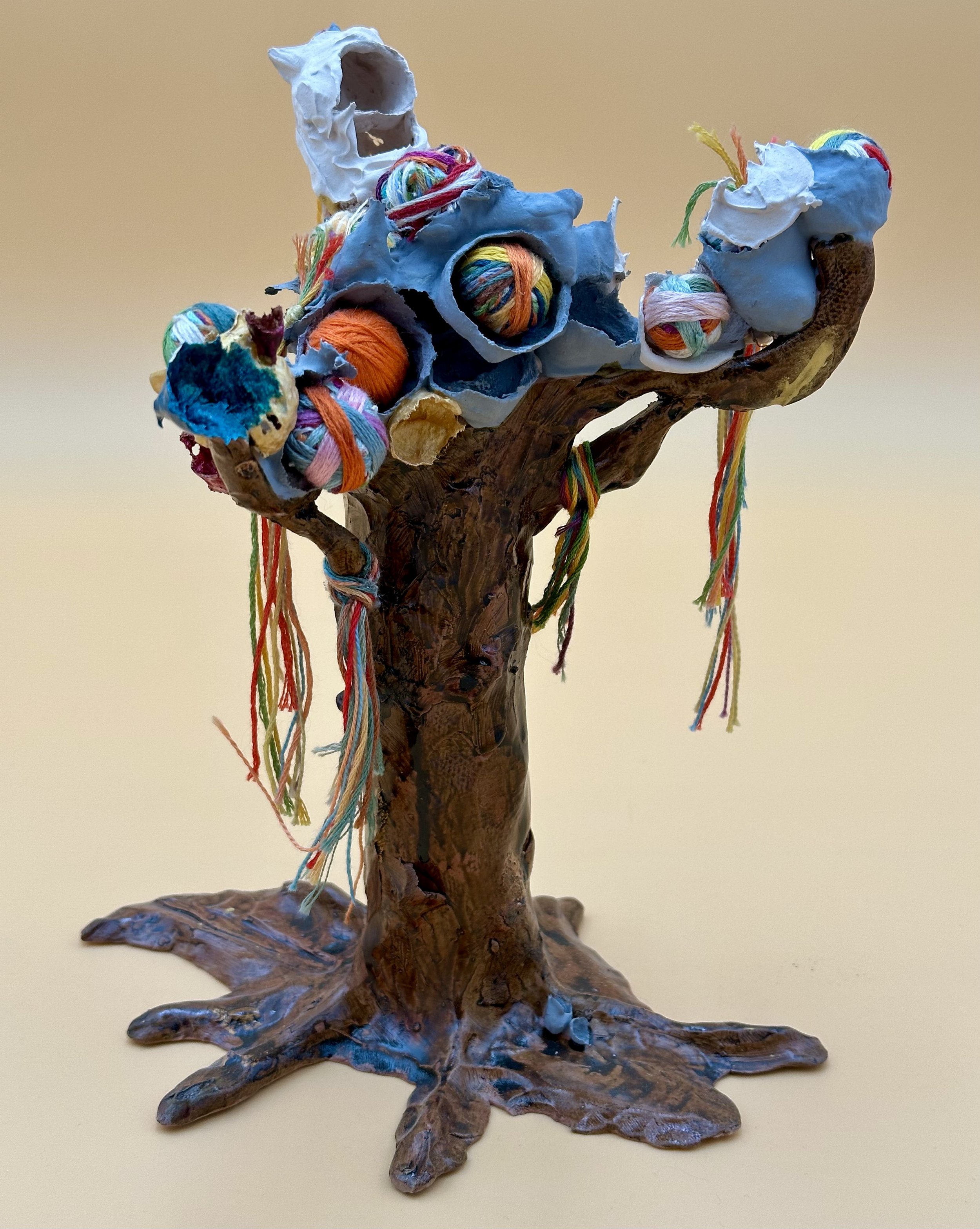 Tree of life. 
My life Growing pains Colors inside the boring, hard skin Roots that went beyond the rug Arms holding loads and loads And I stand tall