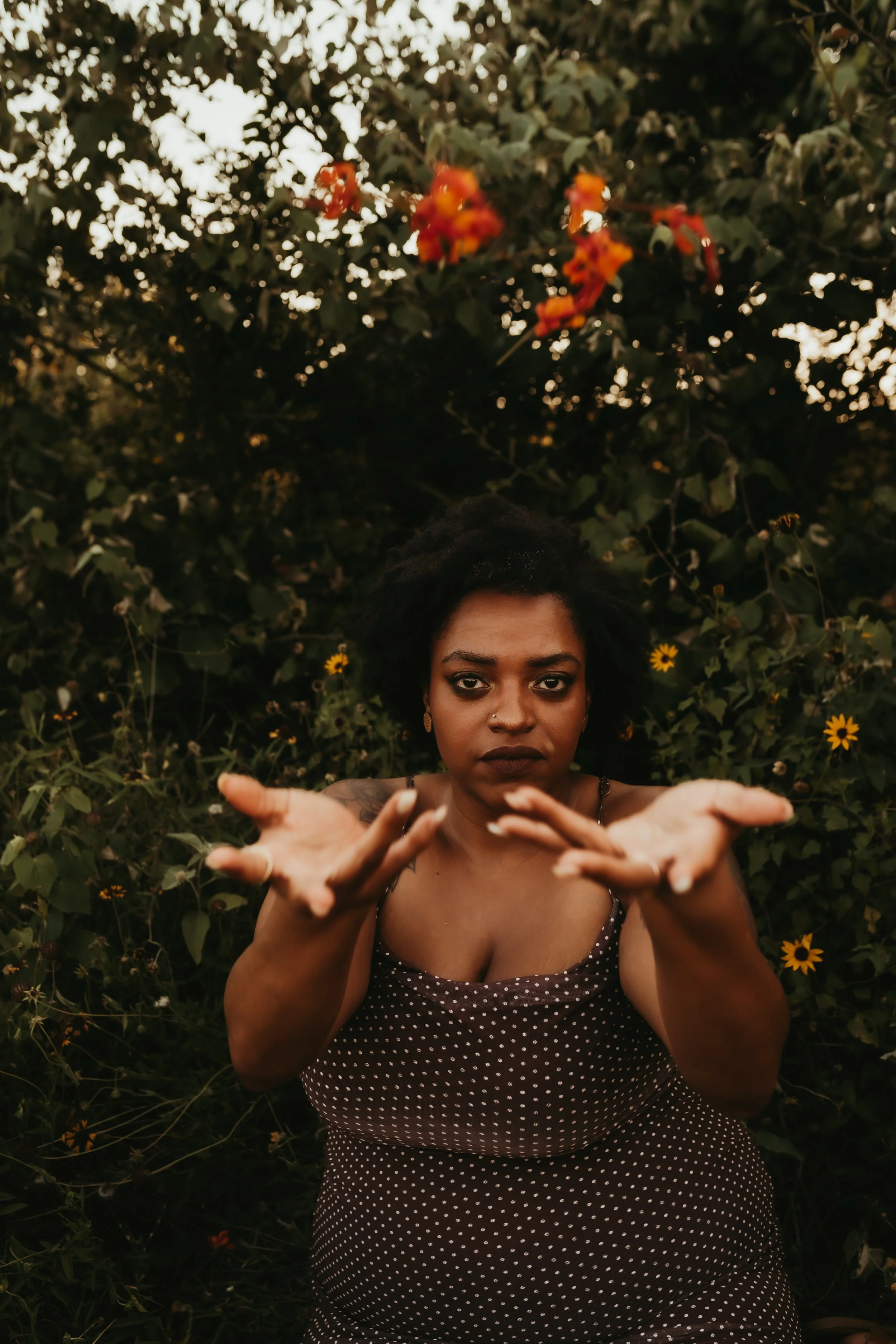 black woman throwing flowers.jpg